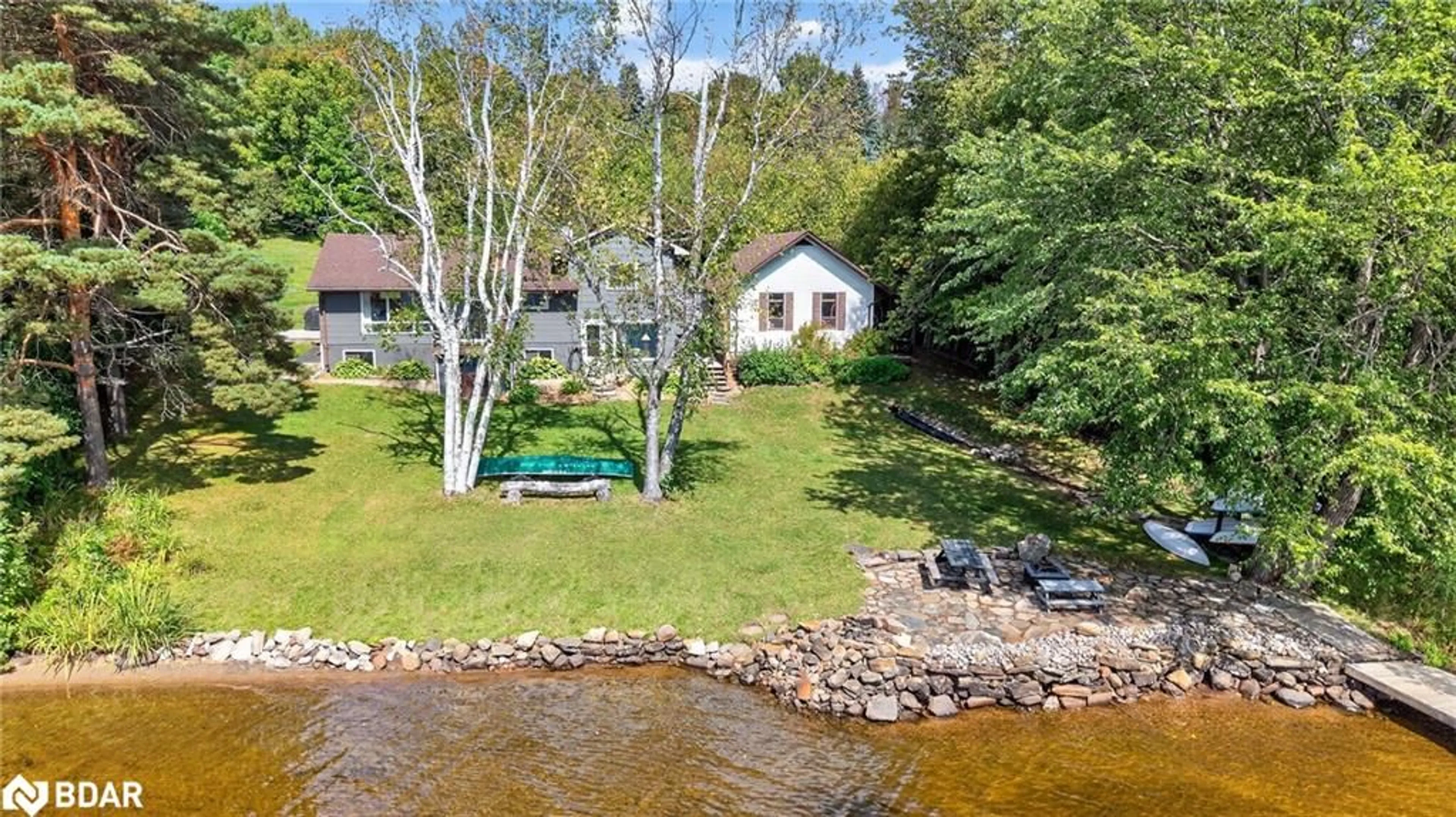 A pic from outside/outdoor area/front of a property/back of a property/a pic from drone, water/lake/river/ocean view for 389 Falcon Rd, Huntsville Ontario P1H 1N3
