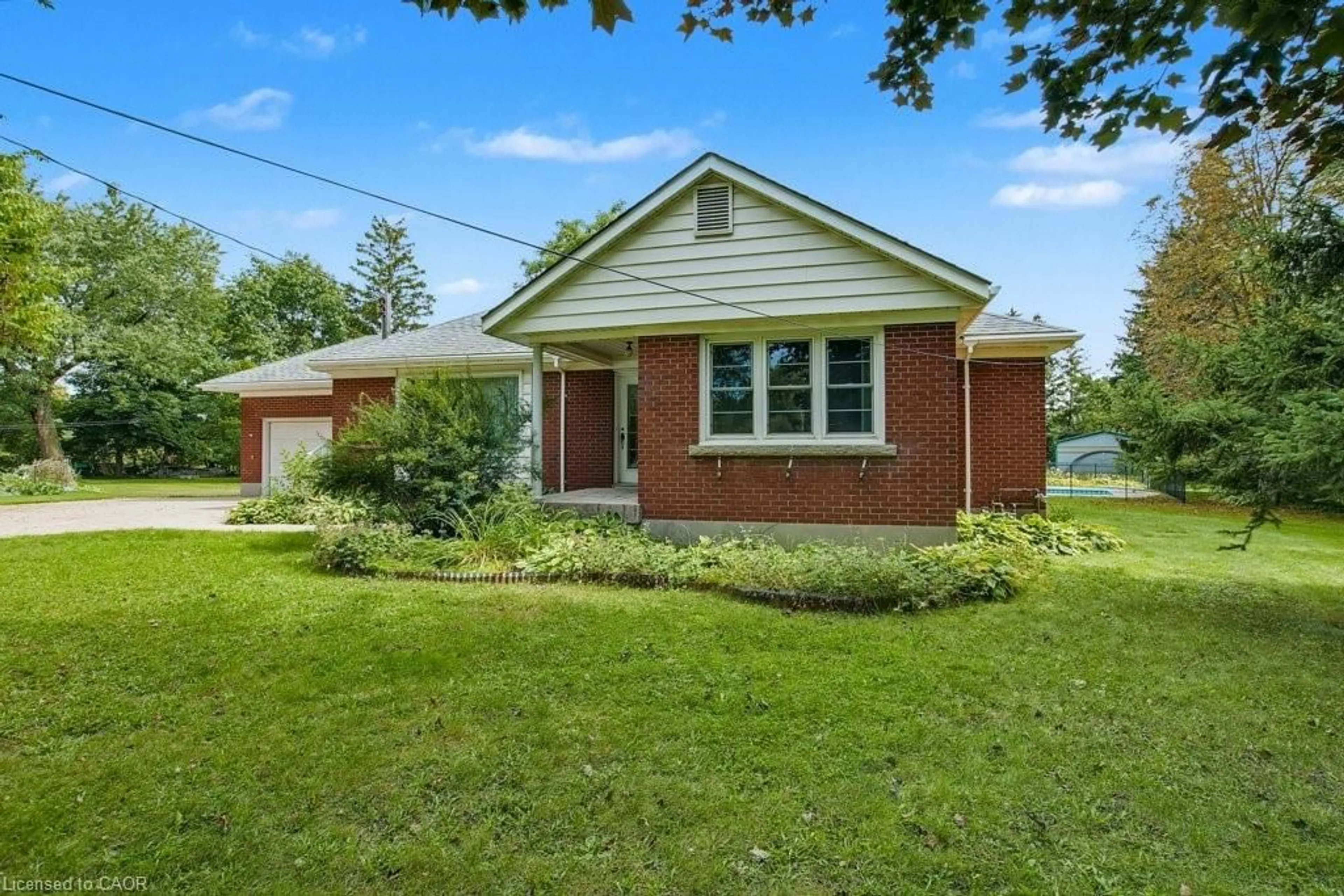 Home with brick exterior material, street for 8007 7 Hwy, Guelph/Eramosa Ontario N1H 6H8