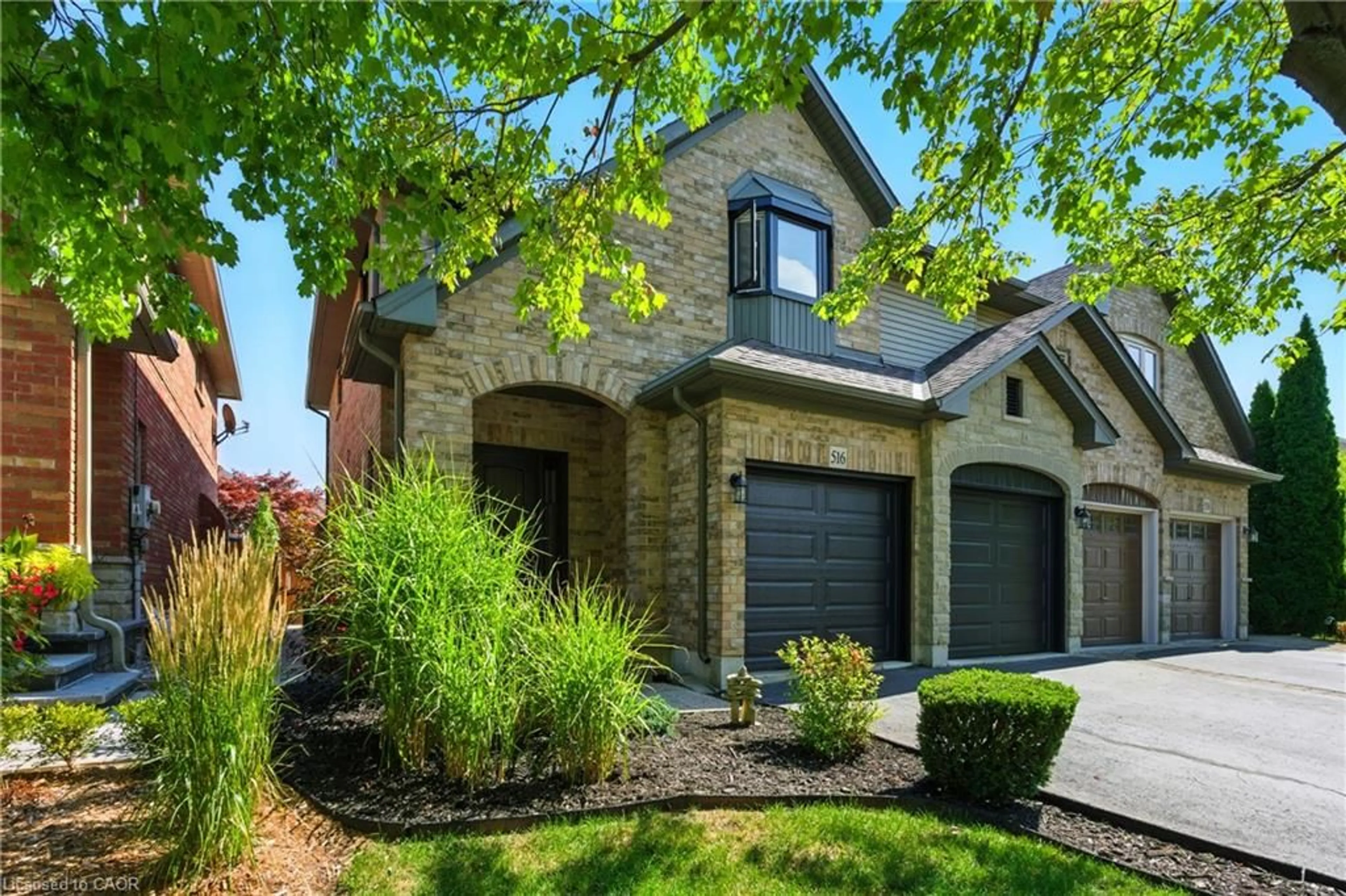 Home with brick exterior material, street for 516 Sandcherry Dr, Burlington Ontario L7T 4L5