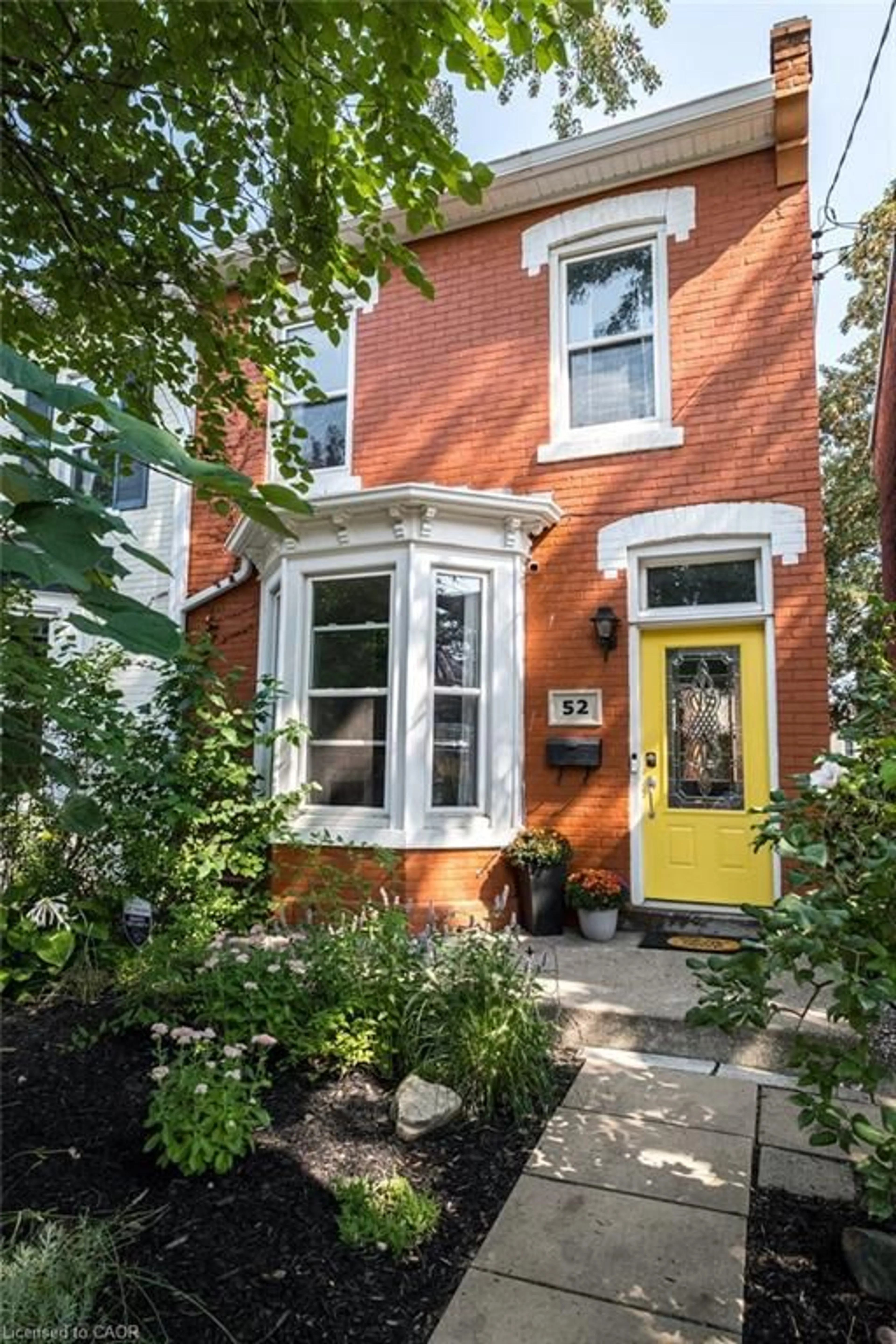 Home with brick exterior material, street for 52 Emerald St, Hamilton Ontario L8L 5K3