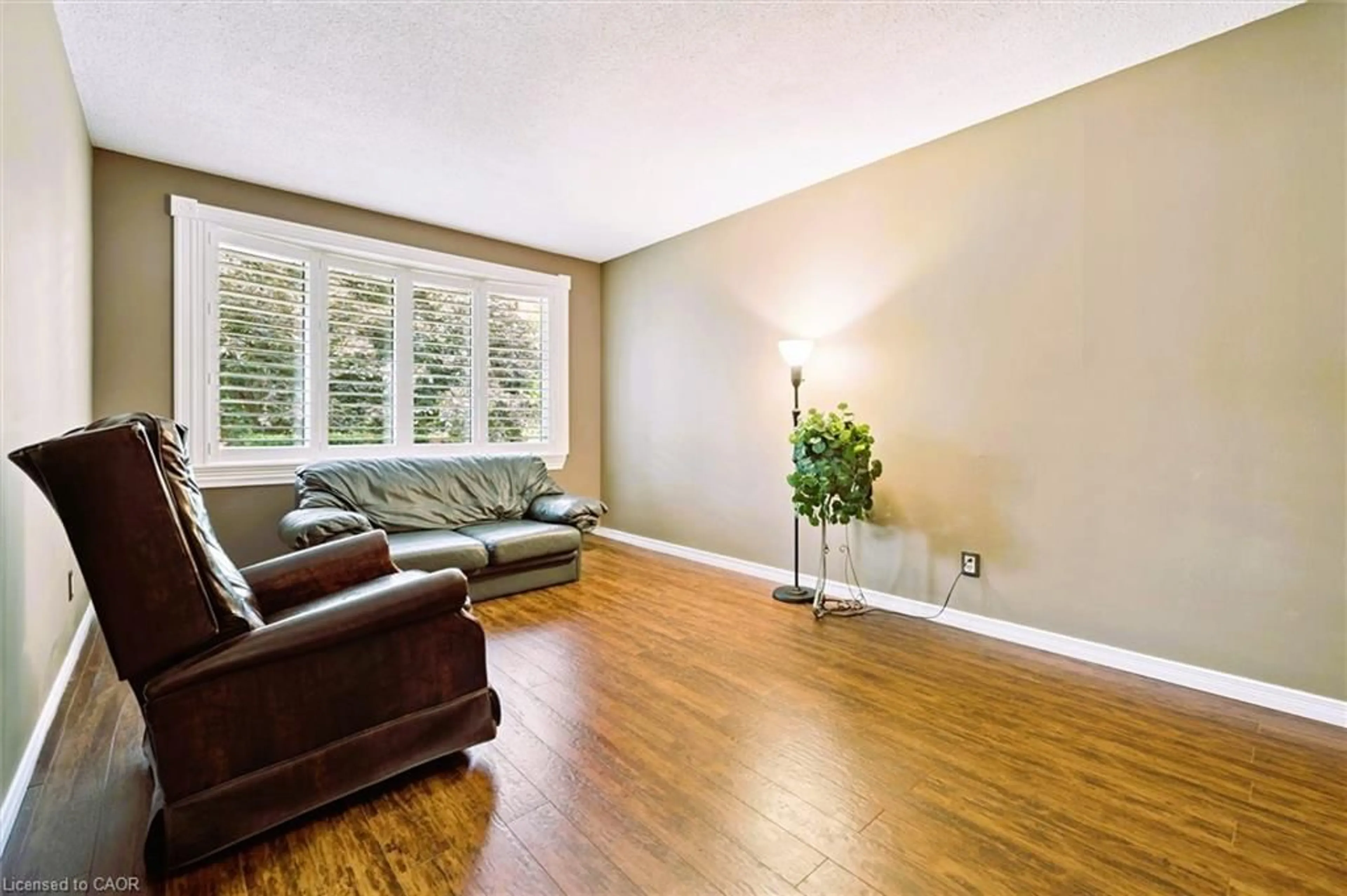 Living room with furniture, wood/laminate floor for 55 Cherry Hill Dr, Kitchener Ontario N2E 1N5