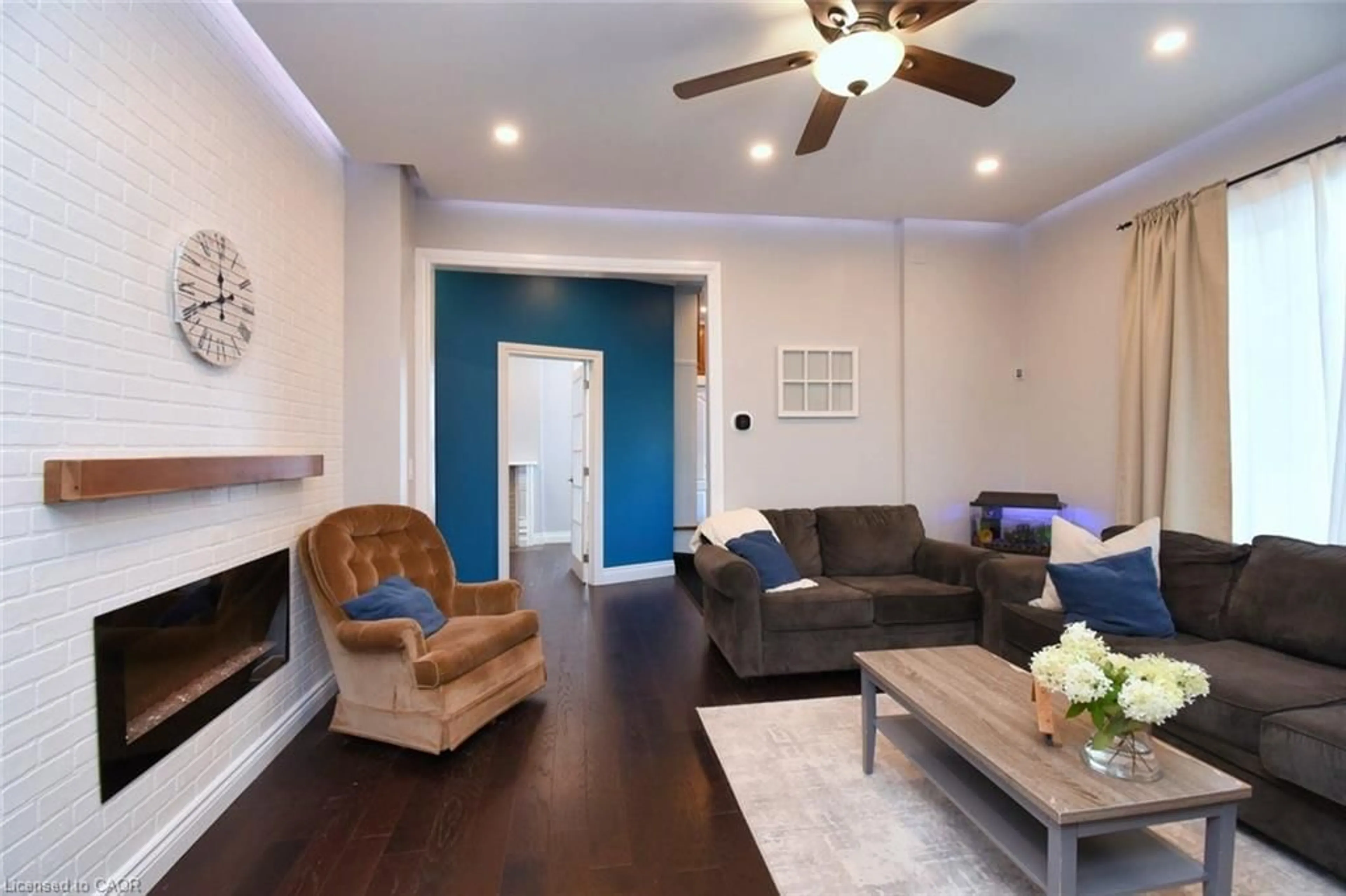Living room with furniture, wood/laminate floor for 111 Drummond St, Brantford Ontario N3S 5Z9