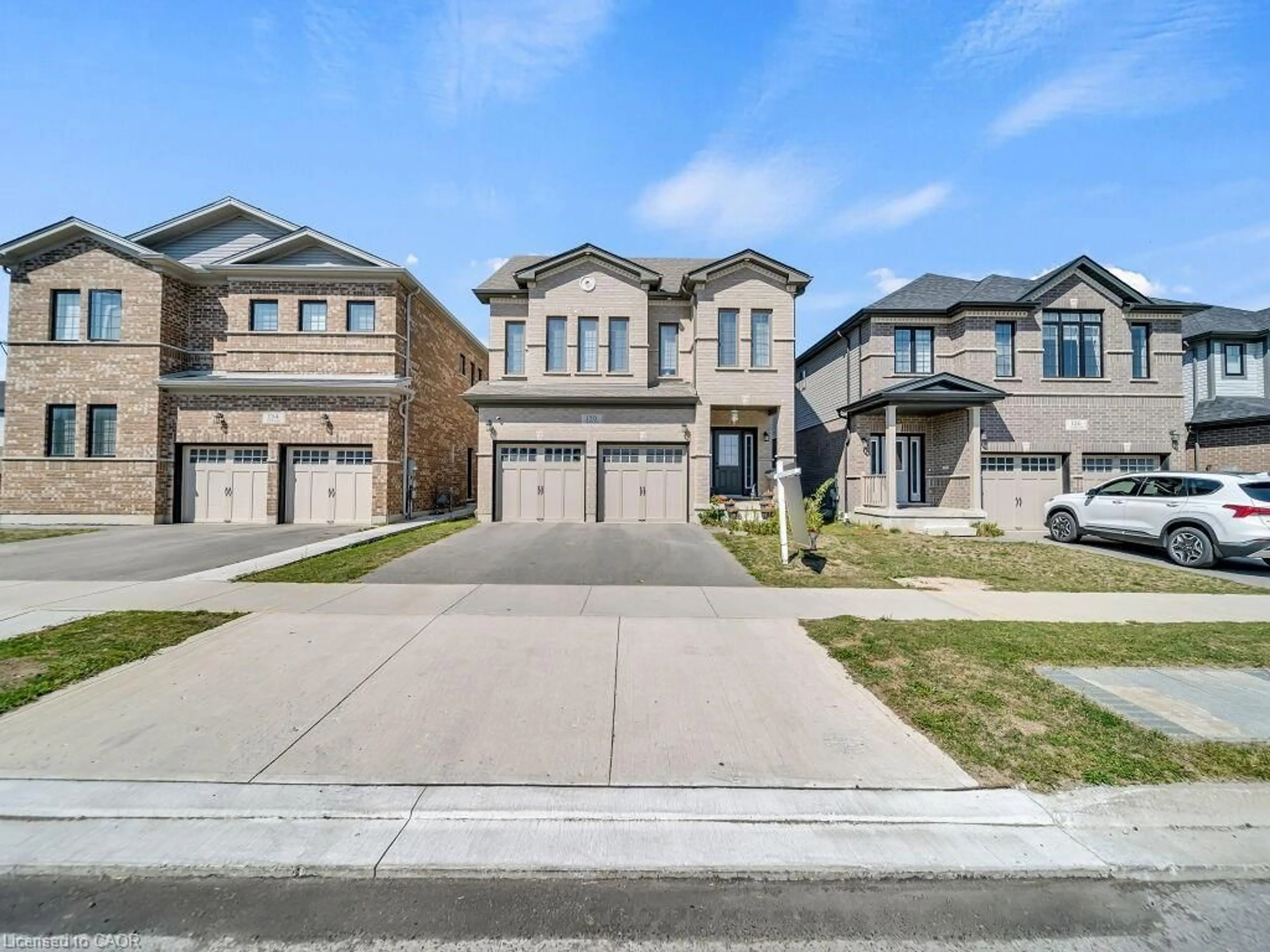 Home with brick exterior material, street for 130 Tartan Ave, Kitchener Ontario N2R 0N4