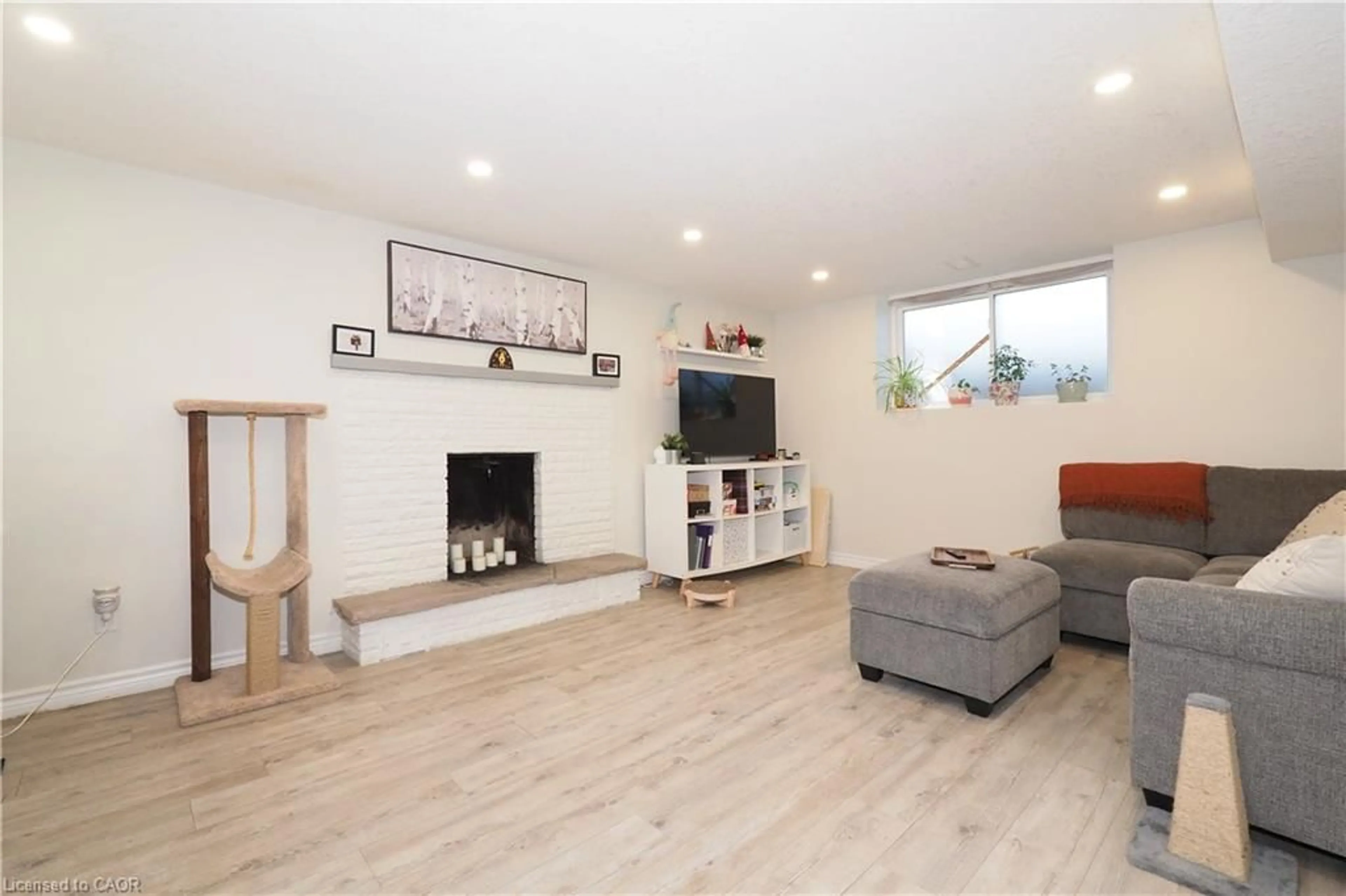 Living room with furniture, wood/laminate floor for 296 Dumfries Ave, Kitchener Ontario N2H 2E8
