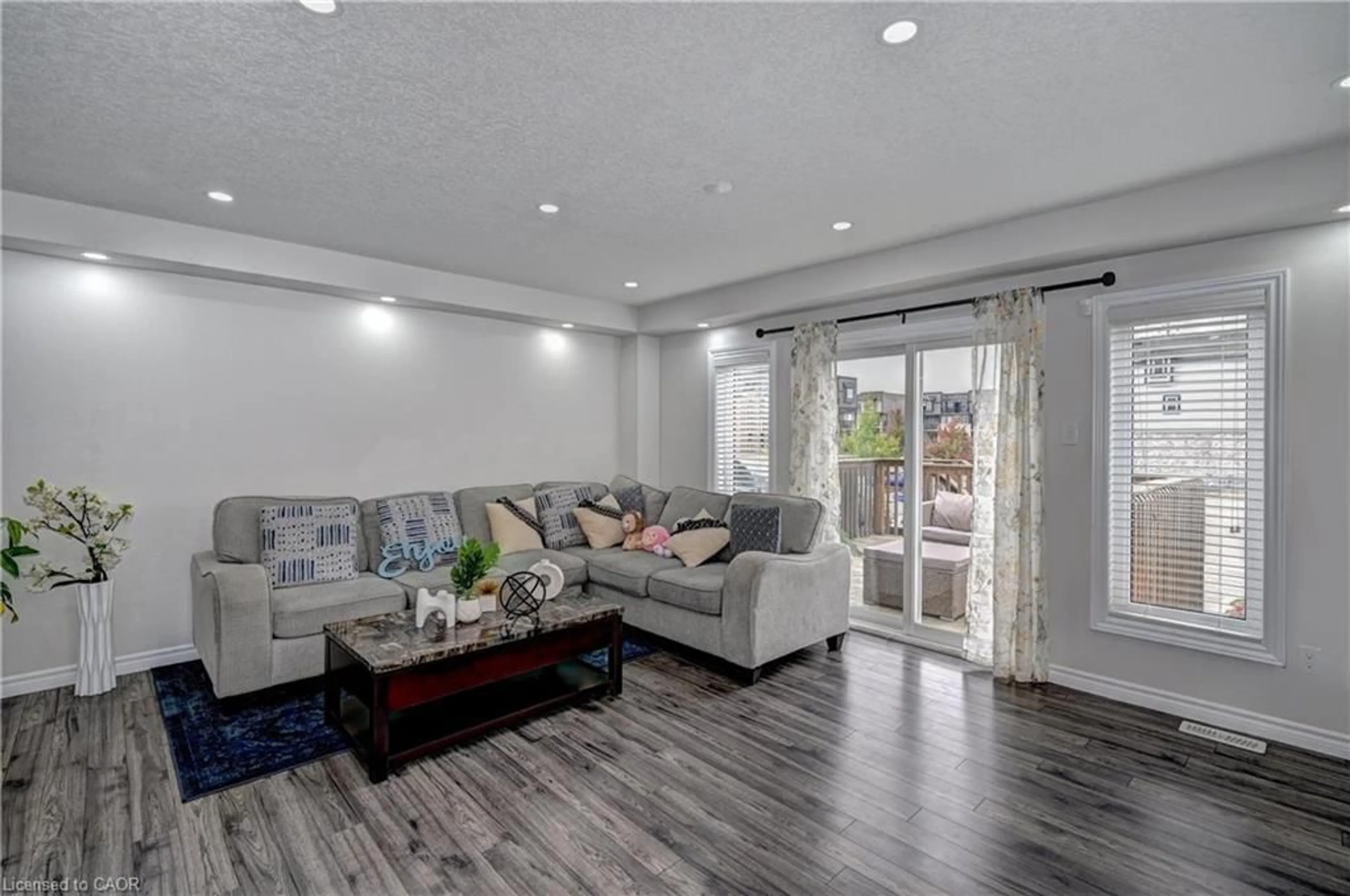 Living room with furniture, wood/laminate floor for 1989 Ottawa St #47, Kitchener Ontario N2E 0G7