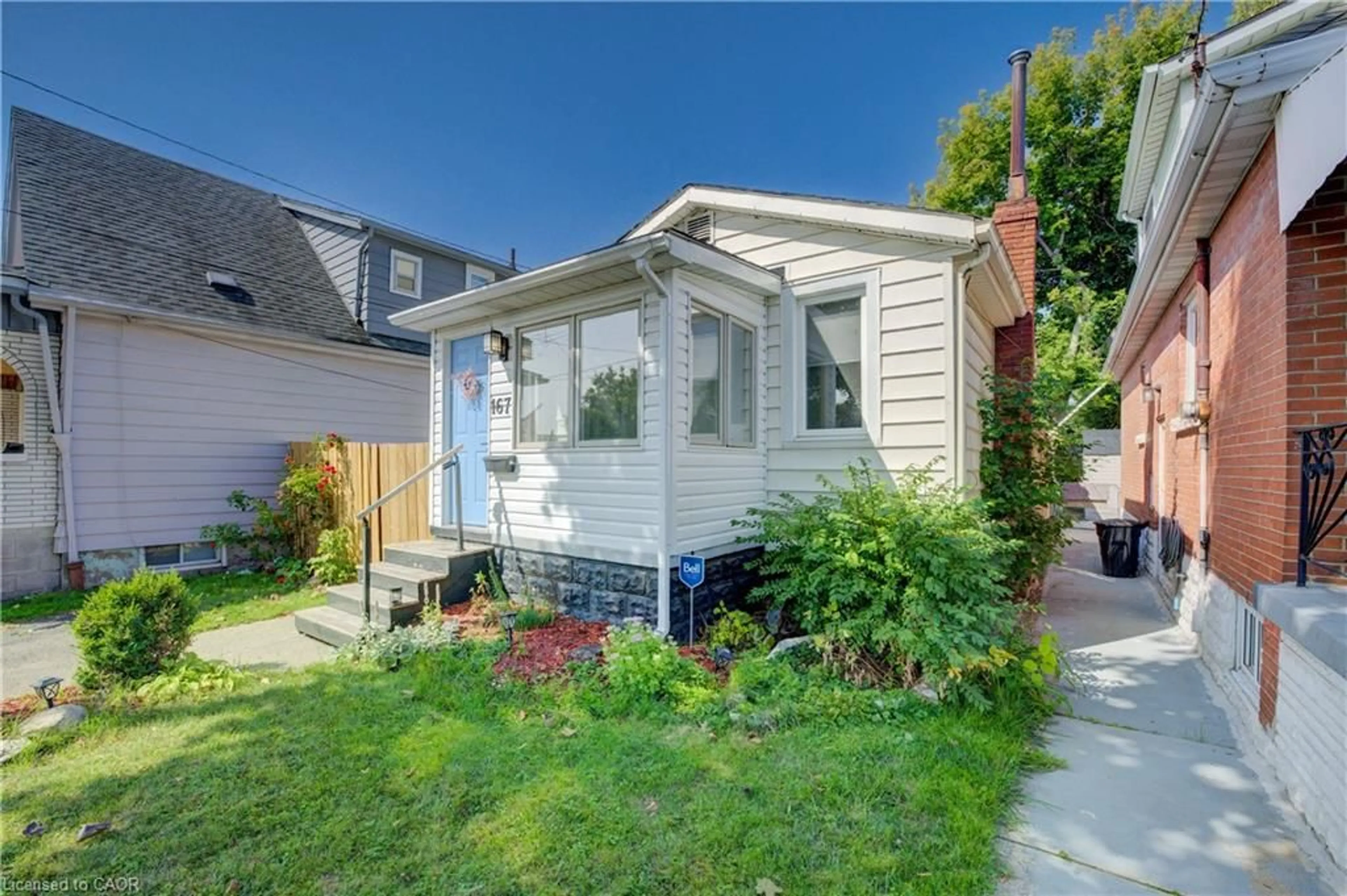 Home with vinyl exterior material, street for 167 Tolton Ave, Hamilton Ontario L8H 5N9
