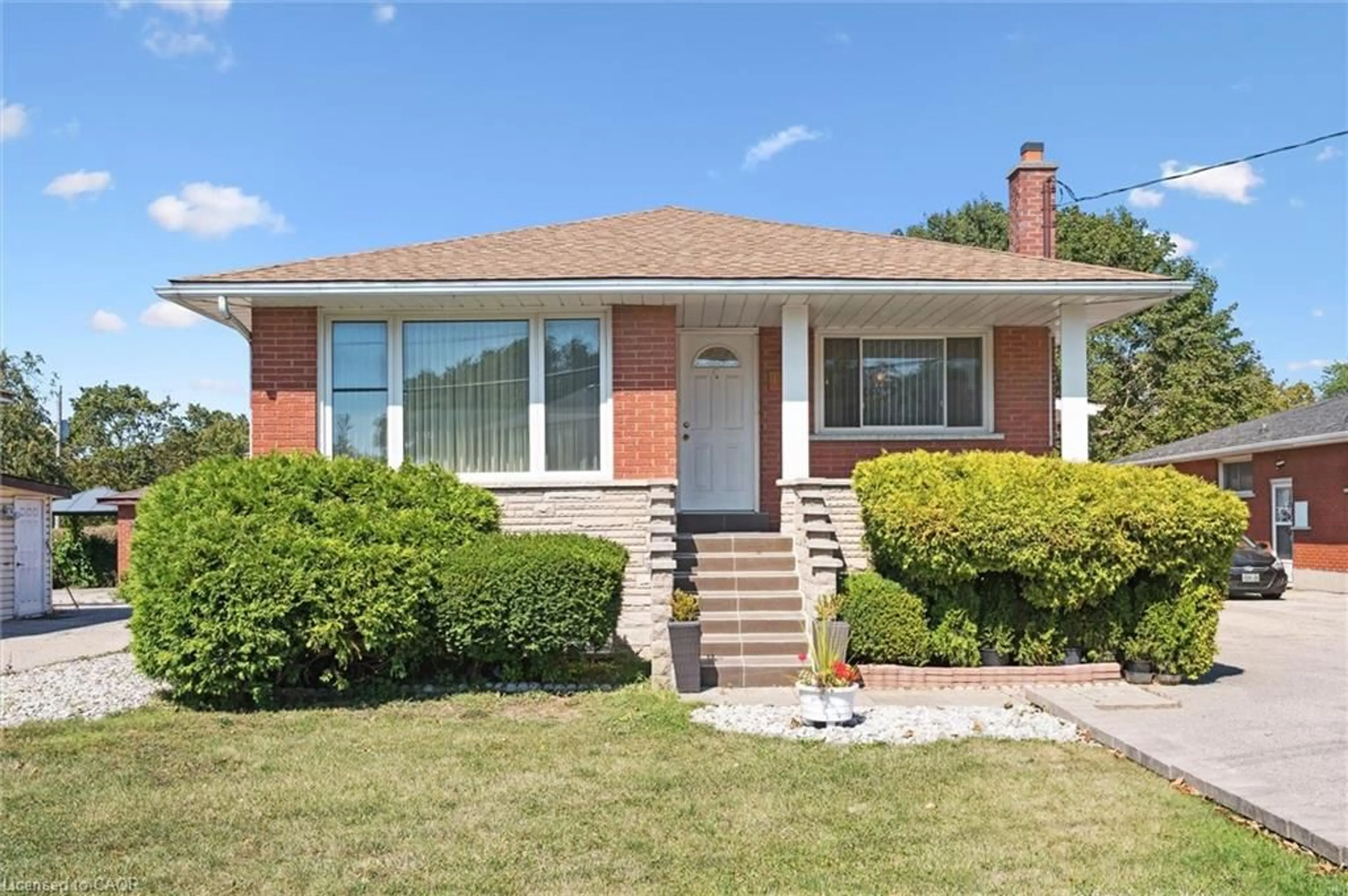 Home with brick exterior material, street for 136 Fairway Rd, Kitchener Ontario N2A 2N6