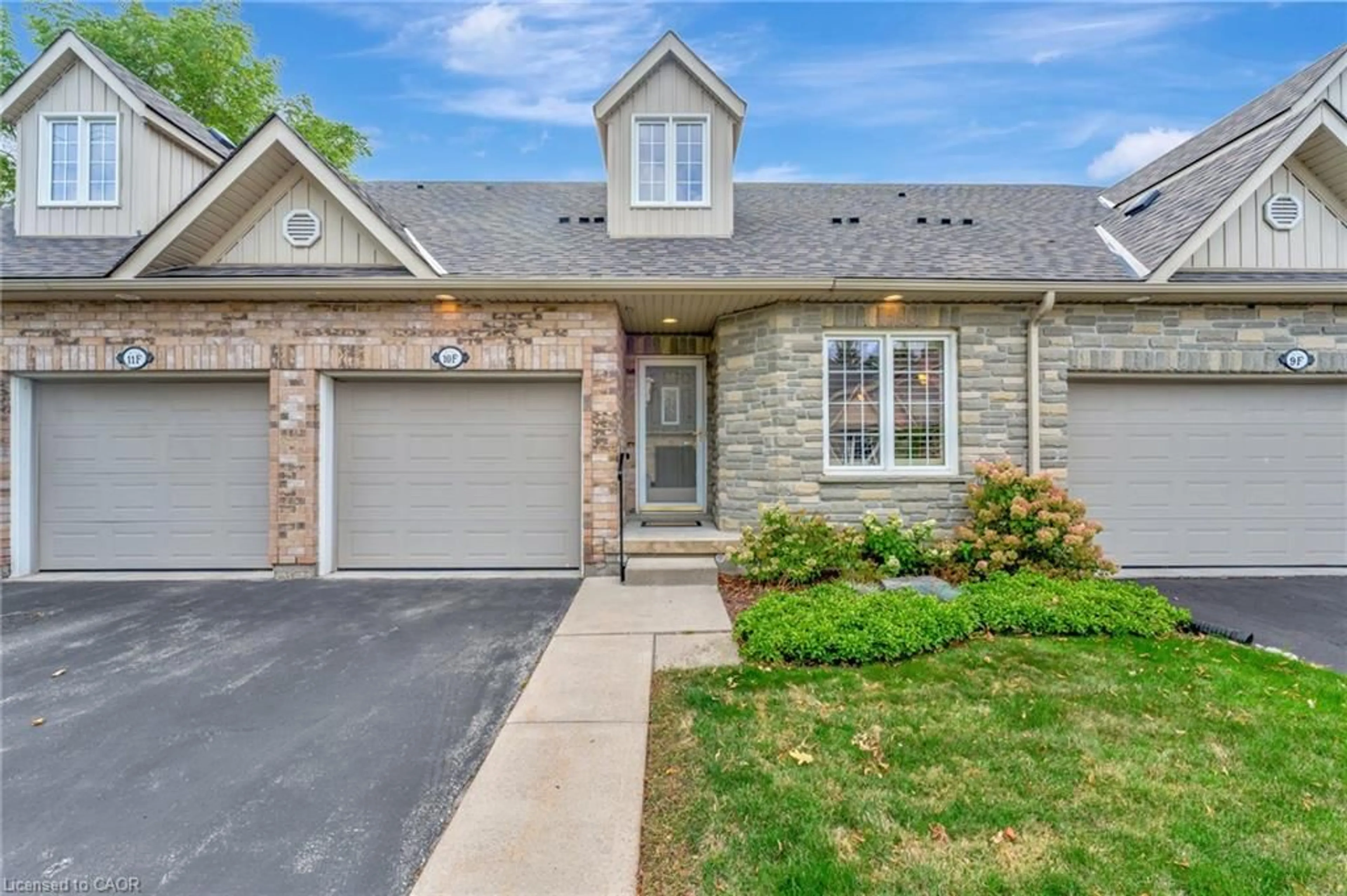Home with brick exterior material, street for 350 Doon Valley Dr #10F, Kitchener Ontario N2P 2M9