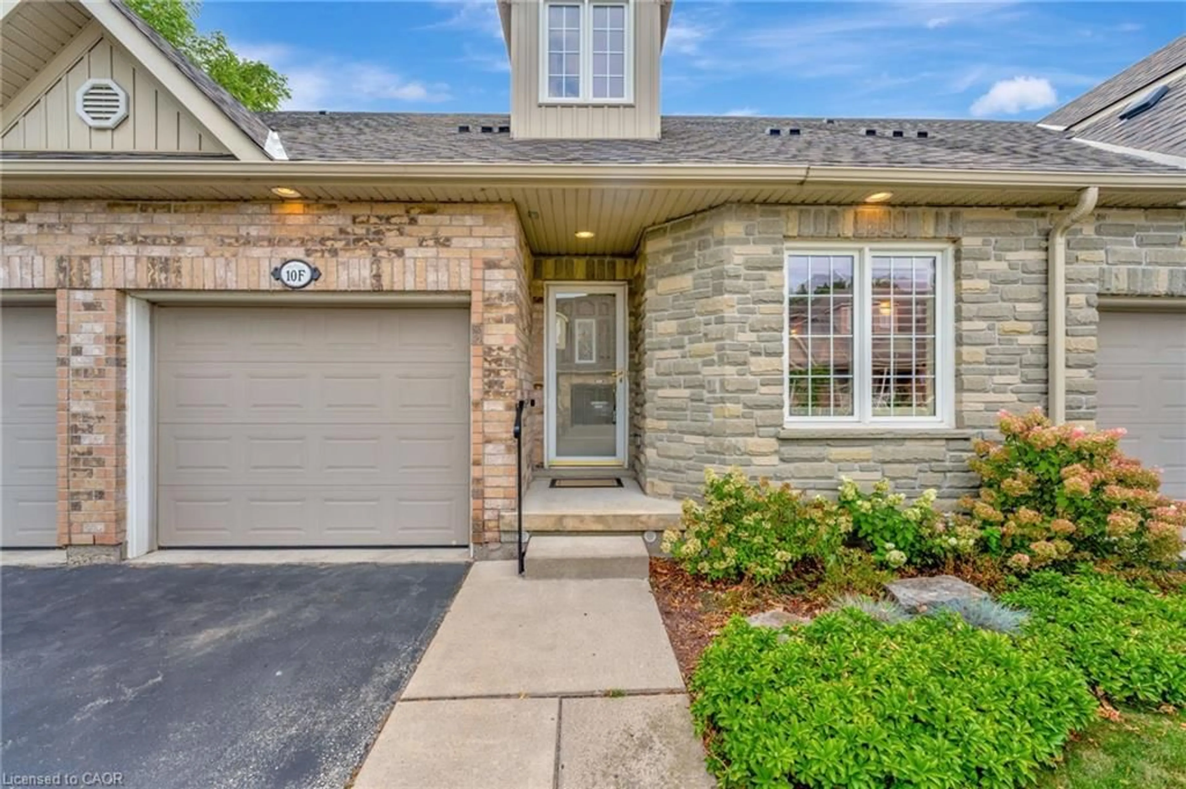 Home with brick exterior material, street for 350 Doon Valley Dr #10F, Kitchener Ontario N2P 2M9
