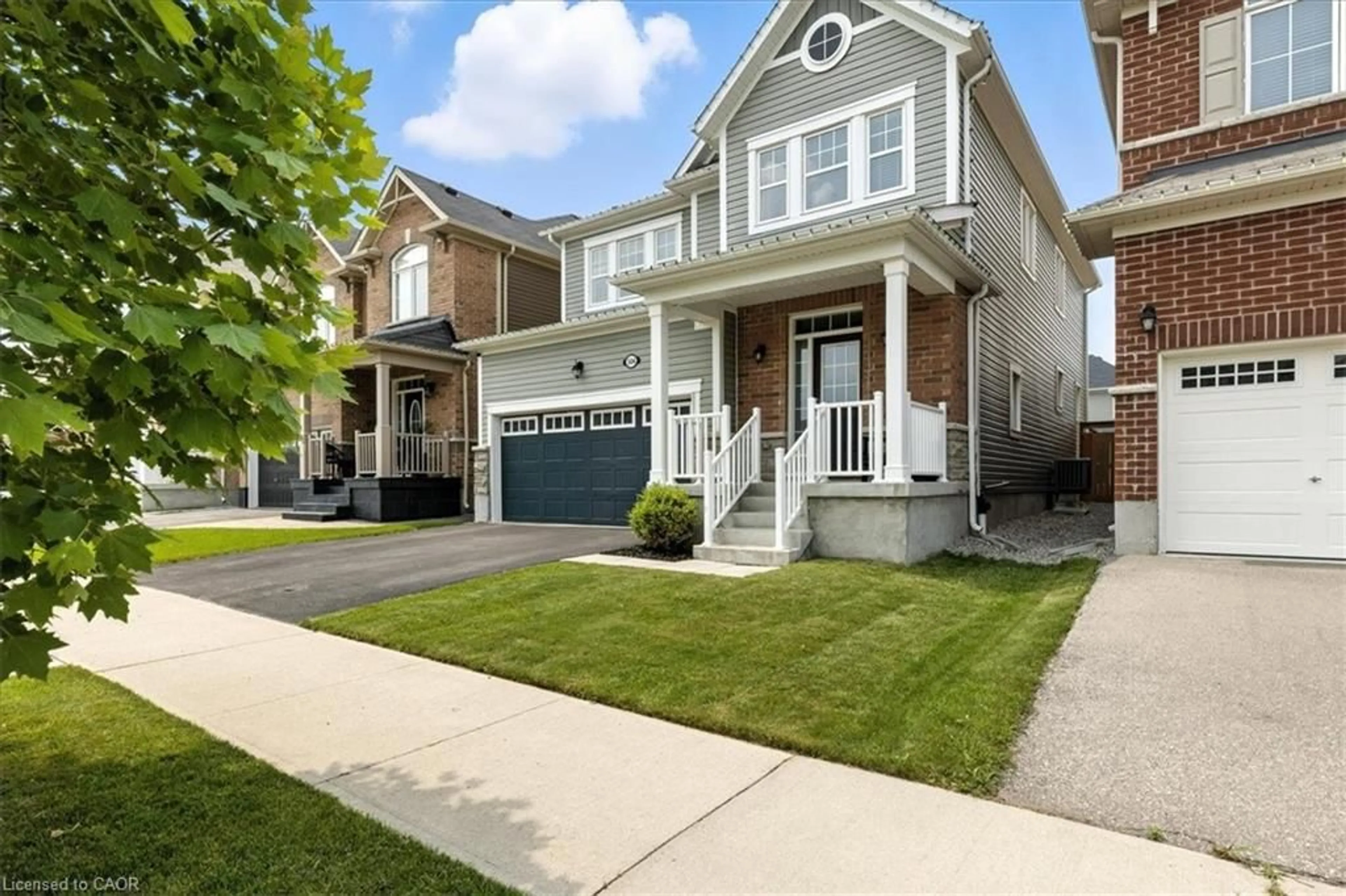 Home with vinyl exterior material, street for 504 Equestrian Way, Cambridge Ontario N3E 0B5