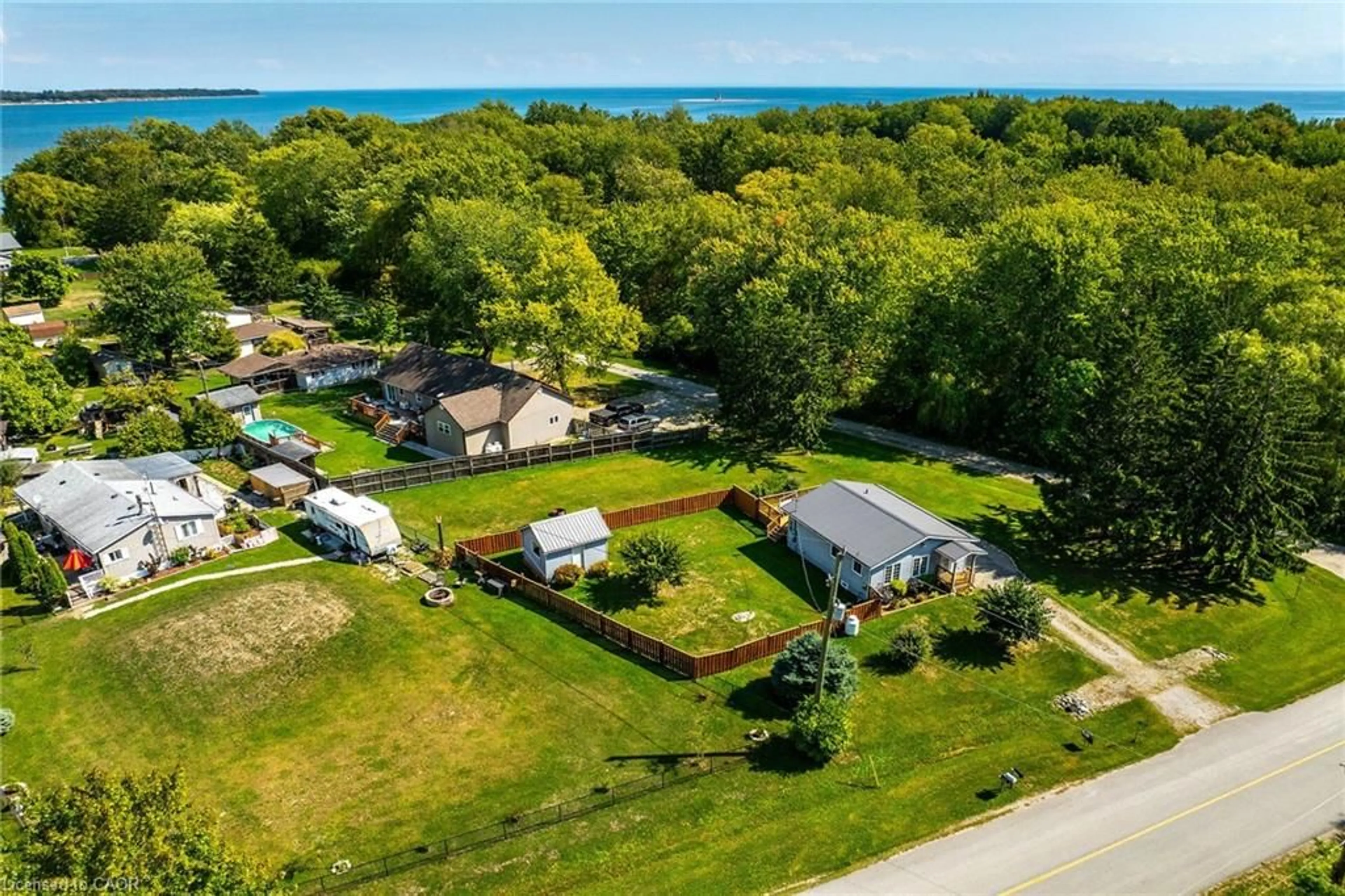 A pic from outside/outdoor area/front of a property/back of a property/a pic from drone, water/lake/river/ocean view for 8 Downey Rd, Lowbanks Ontario N0A 1K0