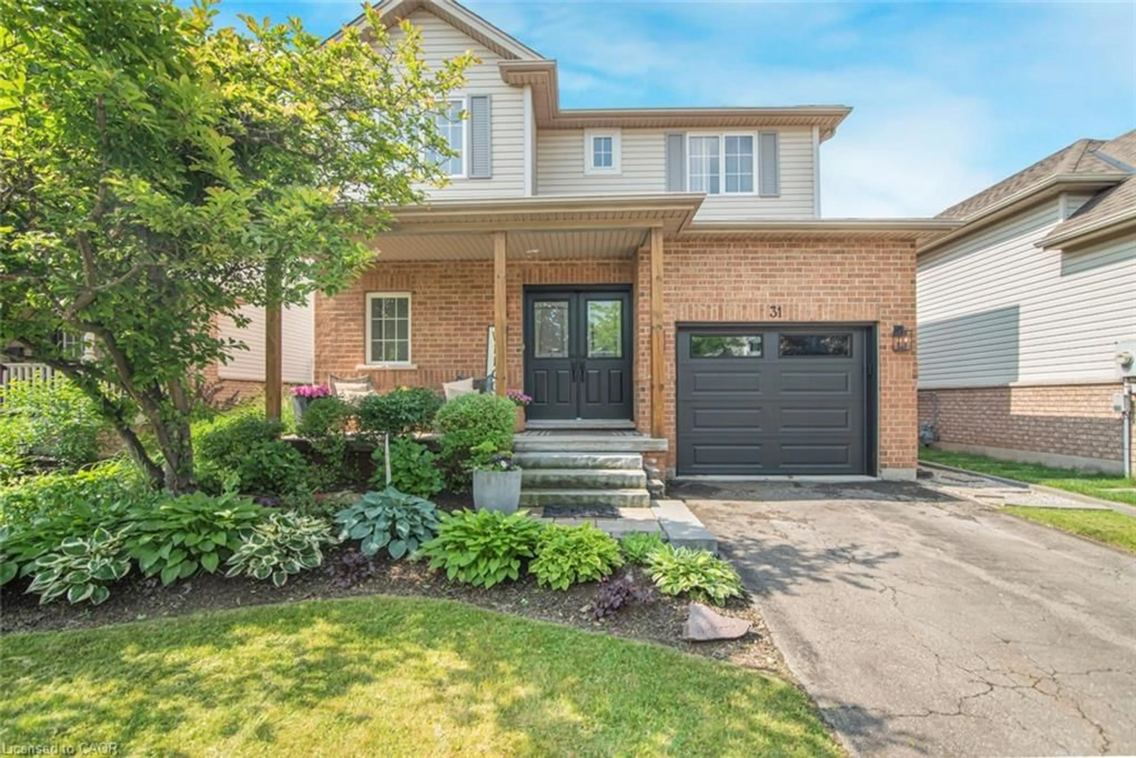 Home with brick exterior material, street for 31 Griffith Dr, Grimsby Ontario L3M 5L2