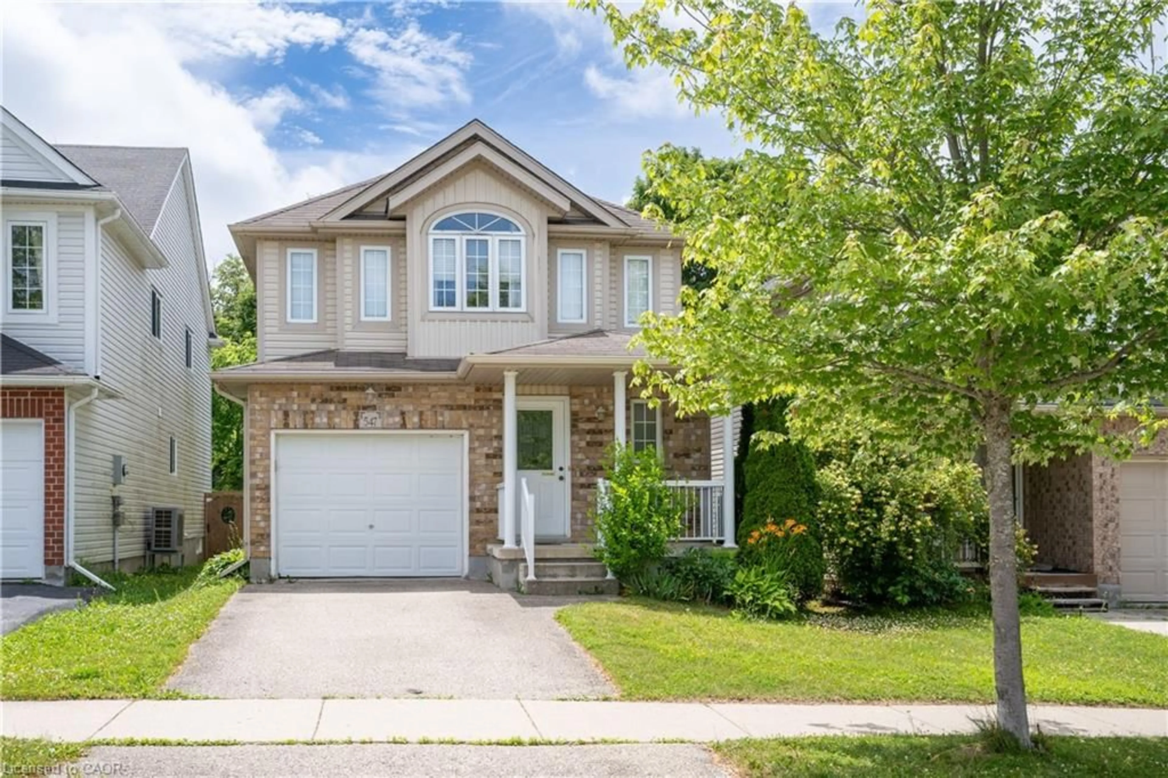 Home with brick exterior material, street for 547 Blue Beech Blvd, Waterloo Ontario N2V 2T4