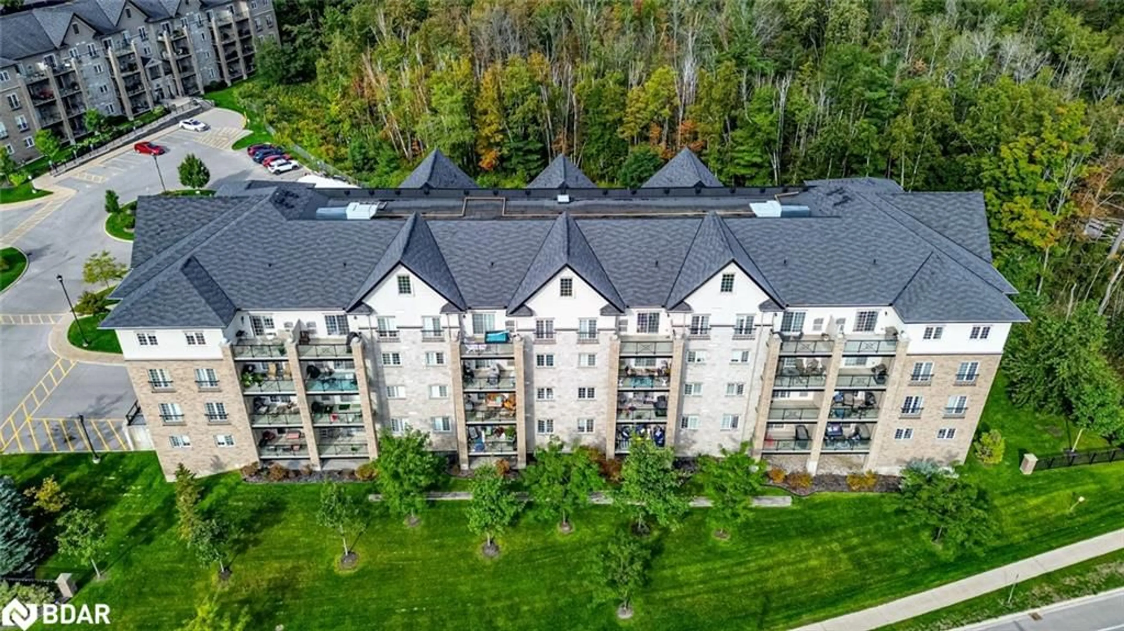 A pic from outside/outdoor area/front of a property/back of a property/a pic from drone, unknown for 40 Ferndale Dr #402, Barrie Ontario L4N 2L3