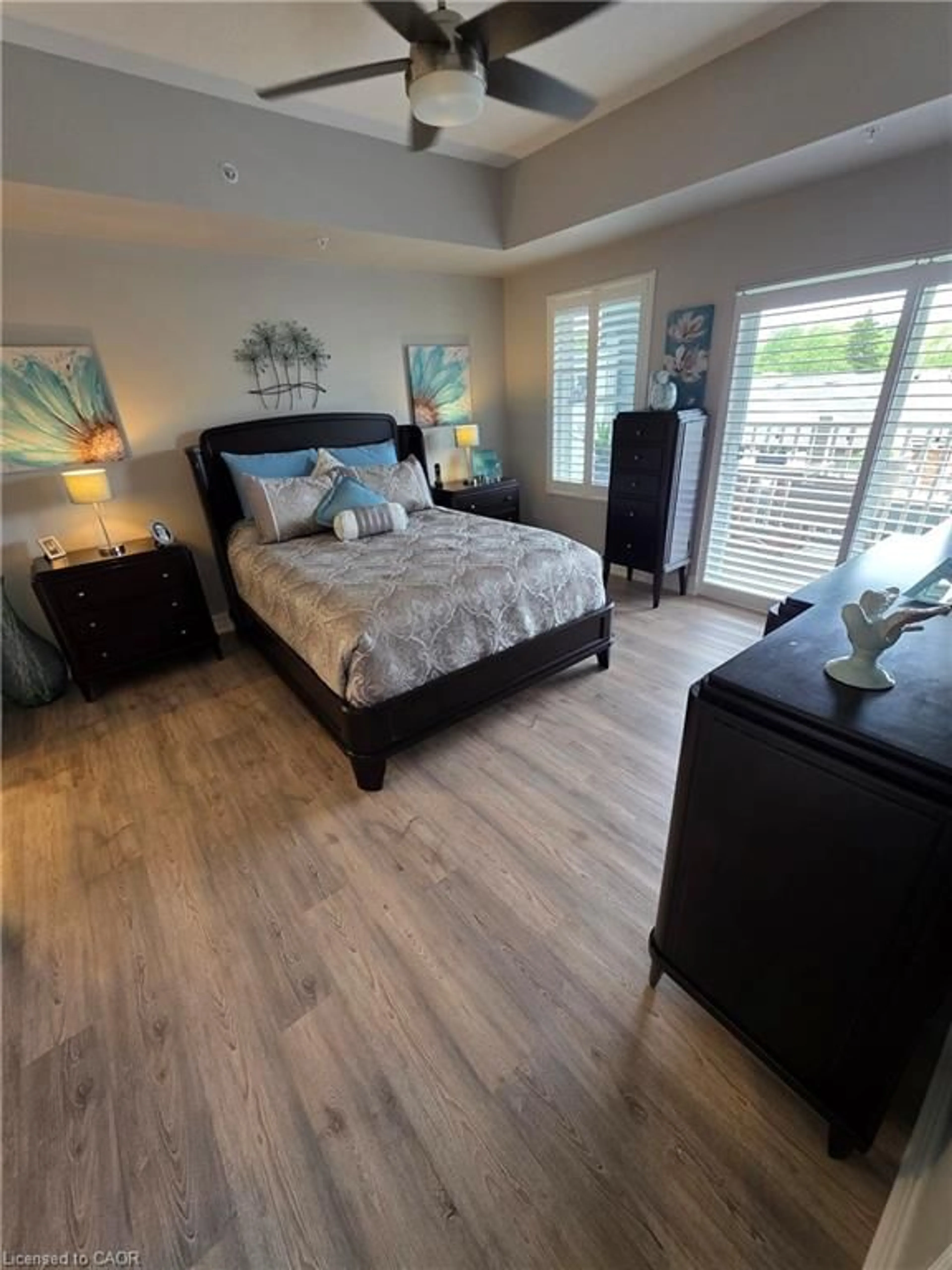Bedroom with bed, wood/laminate floor for 39 Sister Varga Terr #105, Hamilton Ontario L9B 0J7
