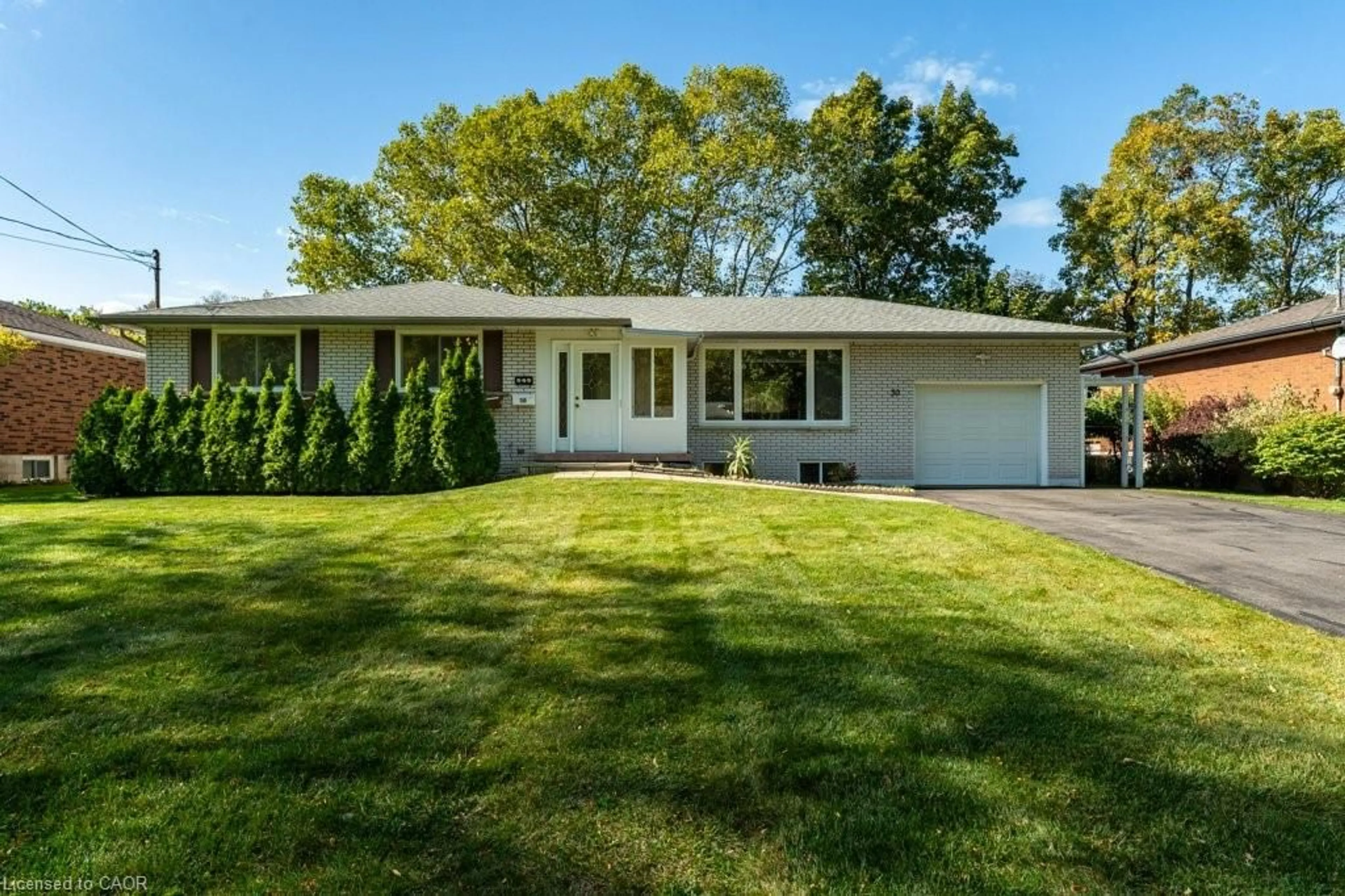 Home with vinyl exterior material, street for 30 Leawood Dr, Grimsby Ontario L3M 4E2