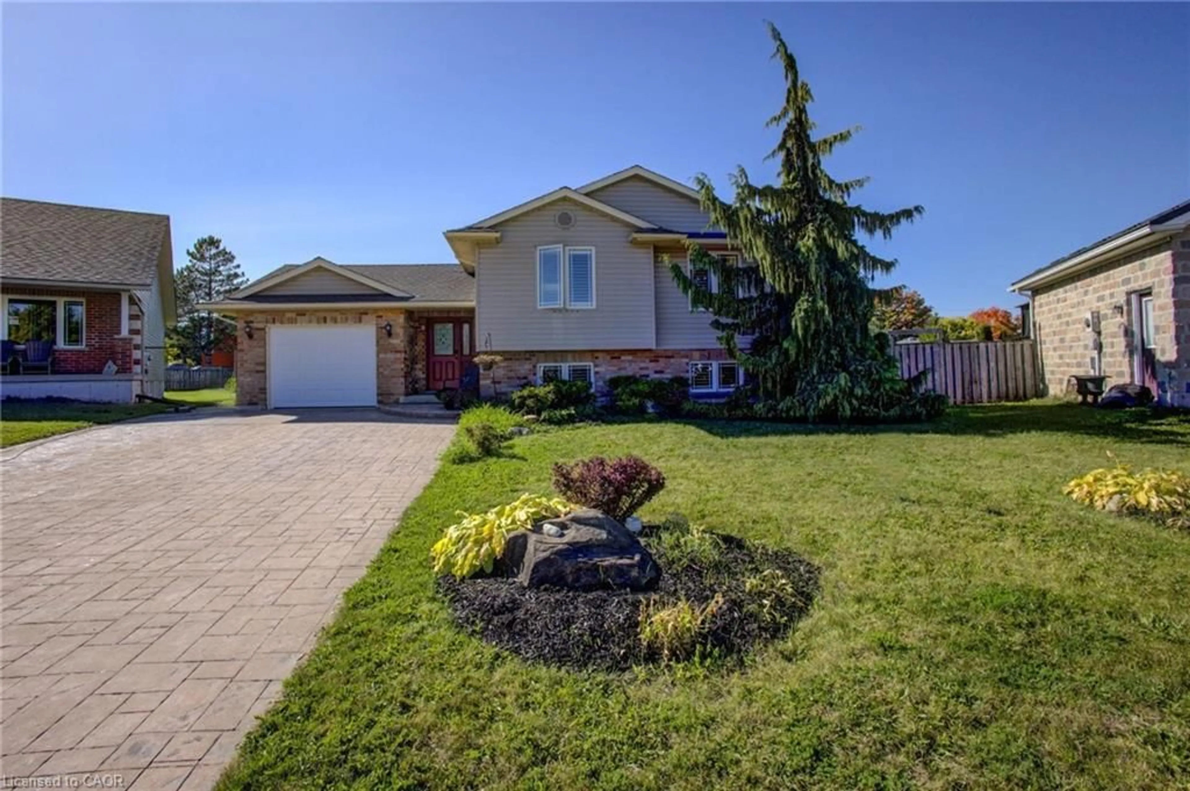 Home with brick exterior material, street for 105 Connery Rd, Mount Forest Ontario N0G 2L2