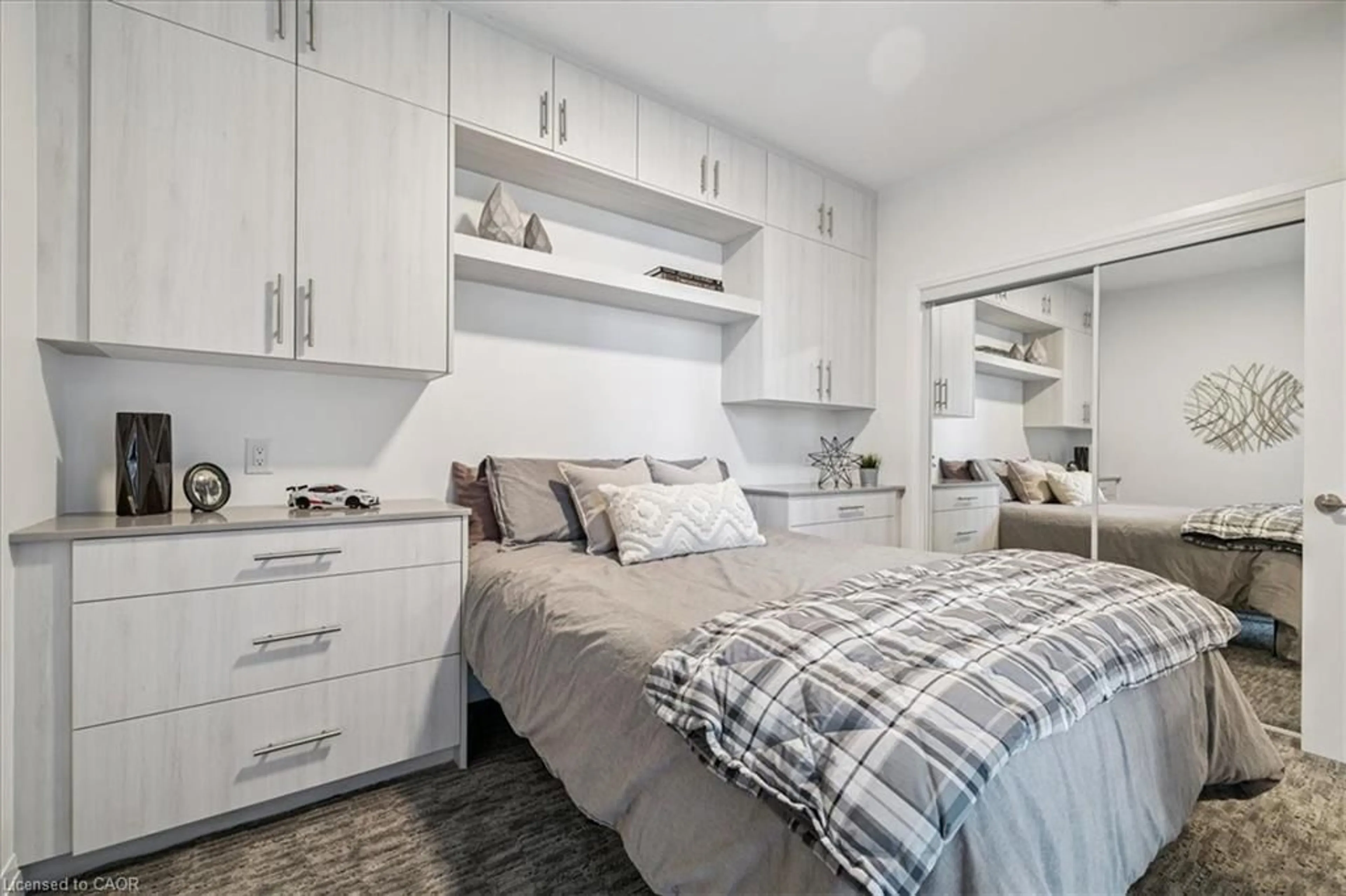 Bedroom with bed, wood/laminate floor for 16 Concord Pl #150, Grimsby Ontario L3M 0J1