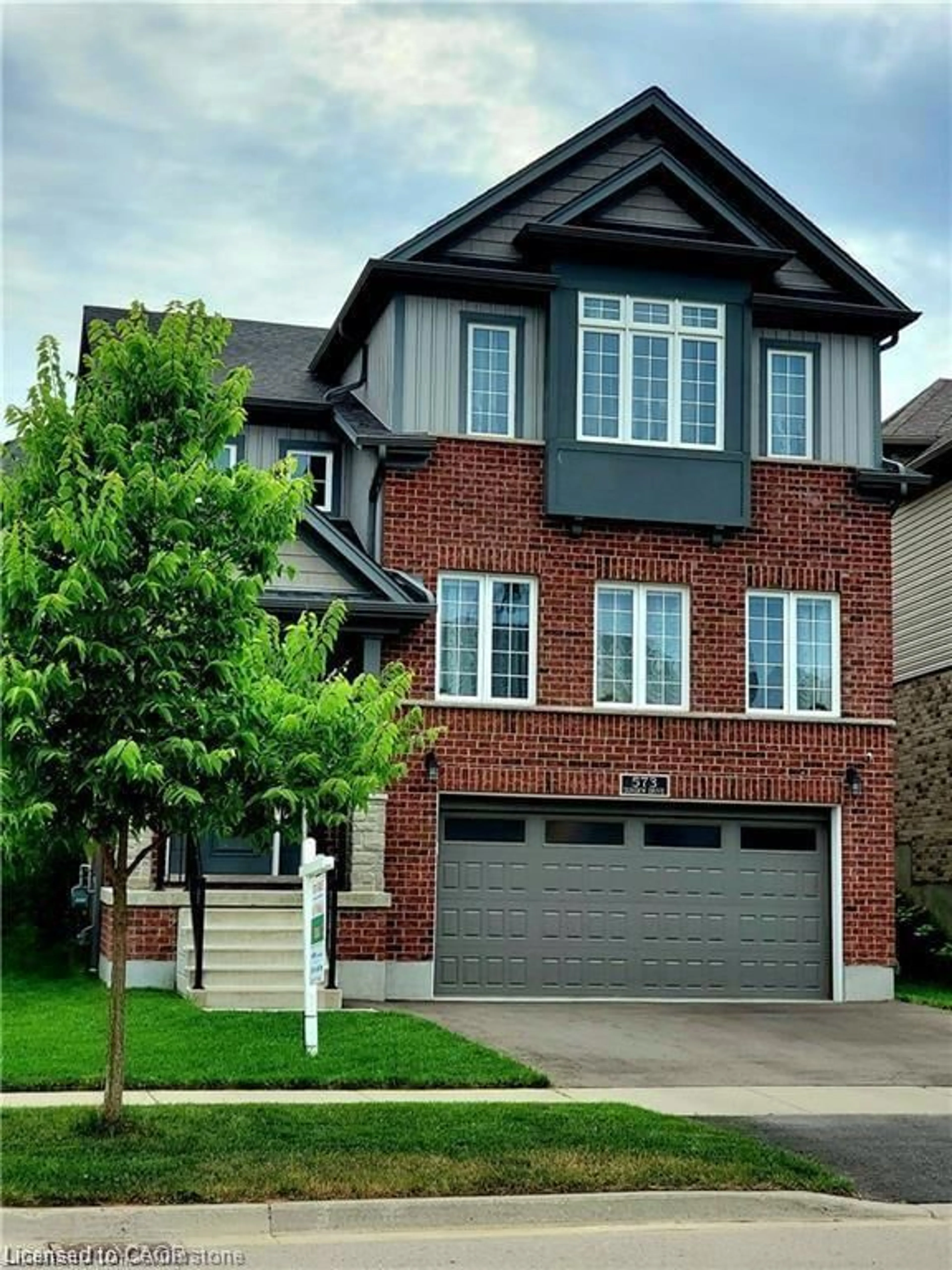 Home with brick exterior material, street for 573 Sundew Dr, Waterloo Ontario N2V 0B9