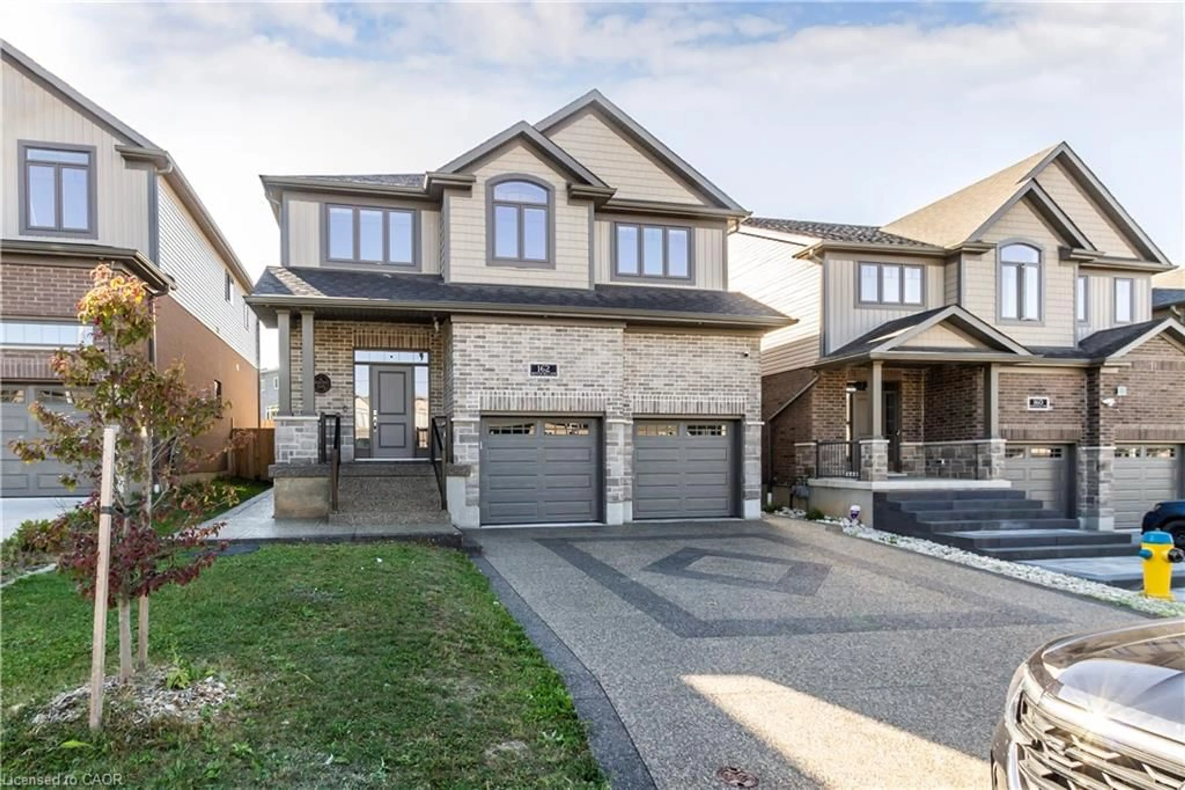 Home with brick exterior material, street for 162 Mountain Holly Court, Waterloo Ontario N2V 0E1