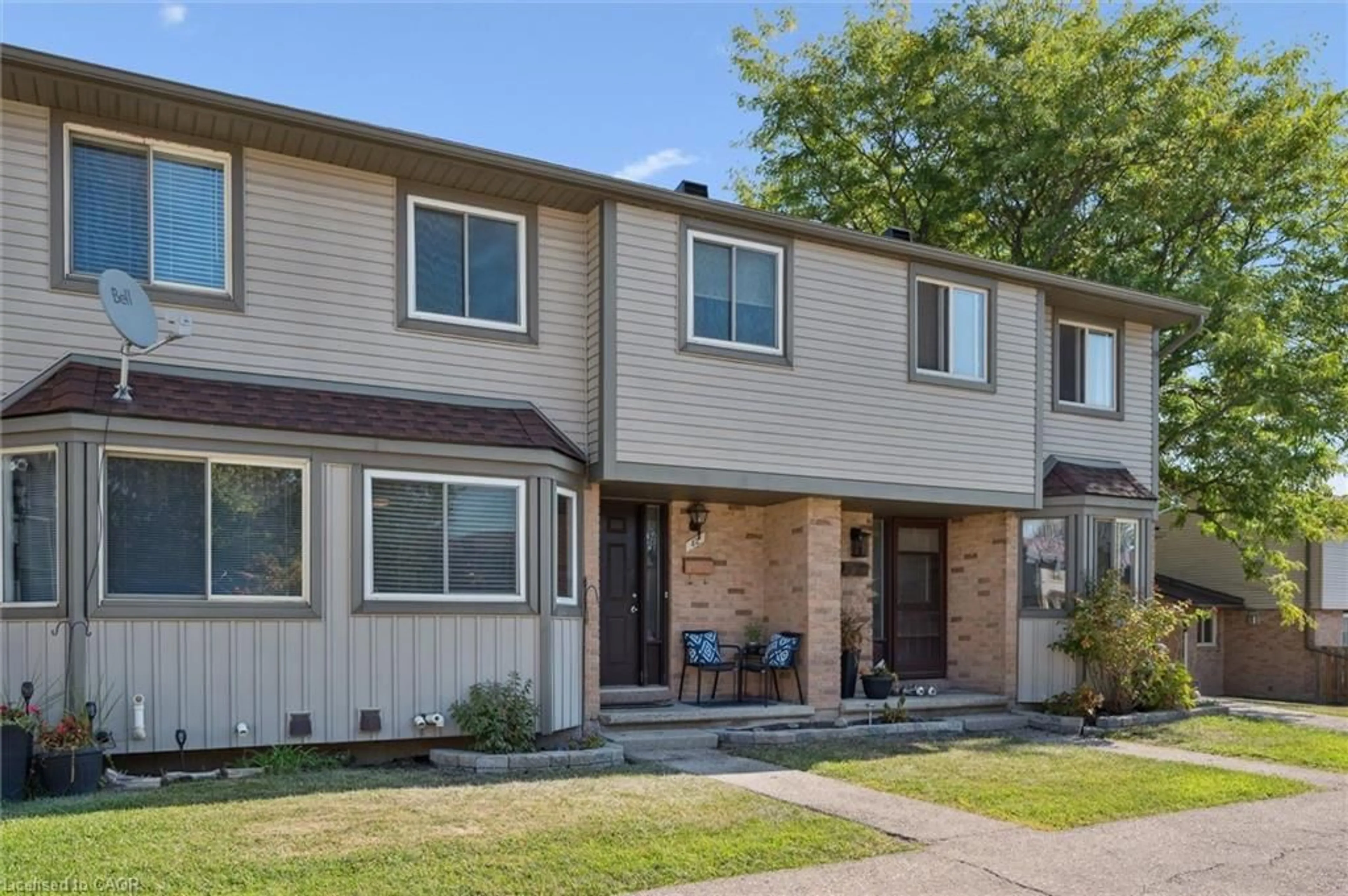 Home with vinyl exterior material, street for 700 Erinbrook Dr #42, Kitchener Ontario N2E 2S7