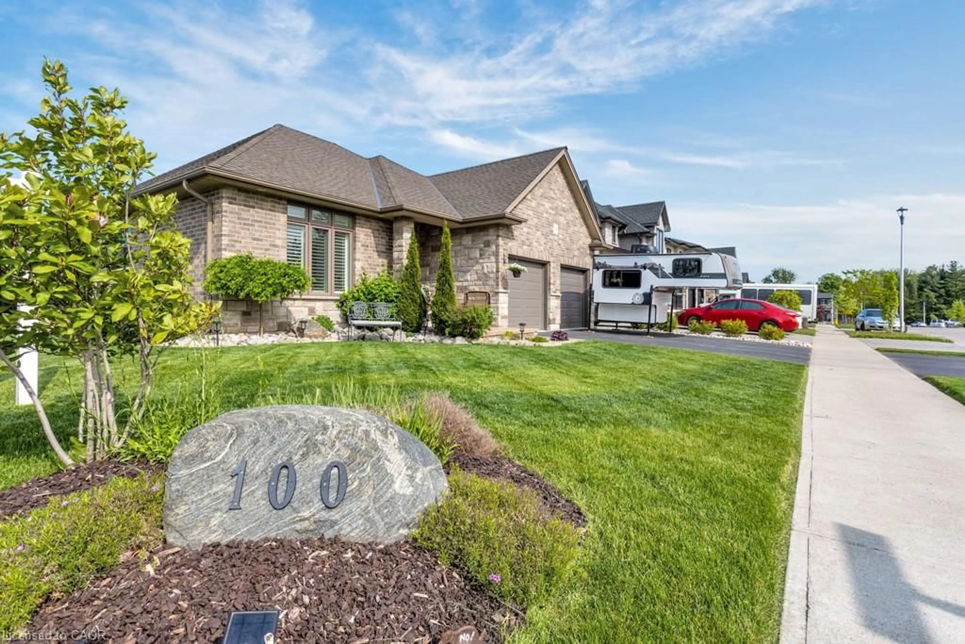 Home with brick exterior material, street for 100 Tamarack Blvd, Woodstock Ontario N4S 0E2