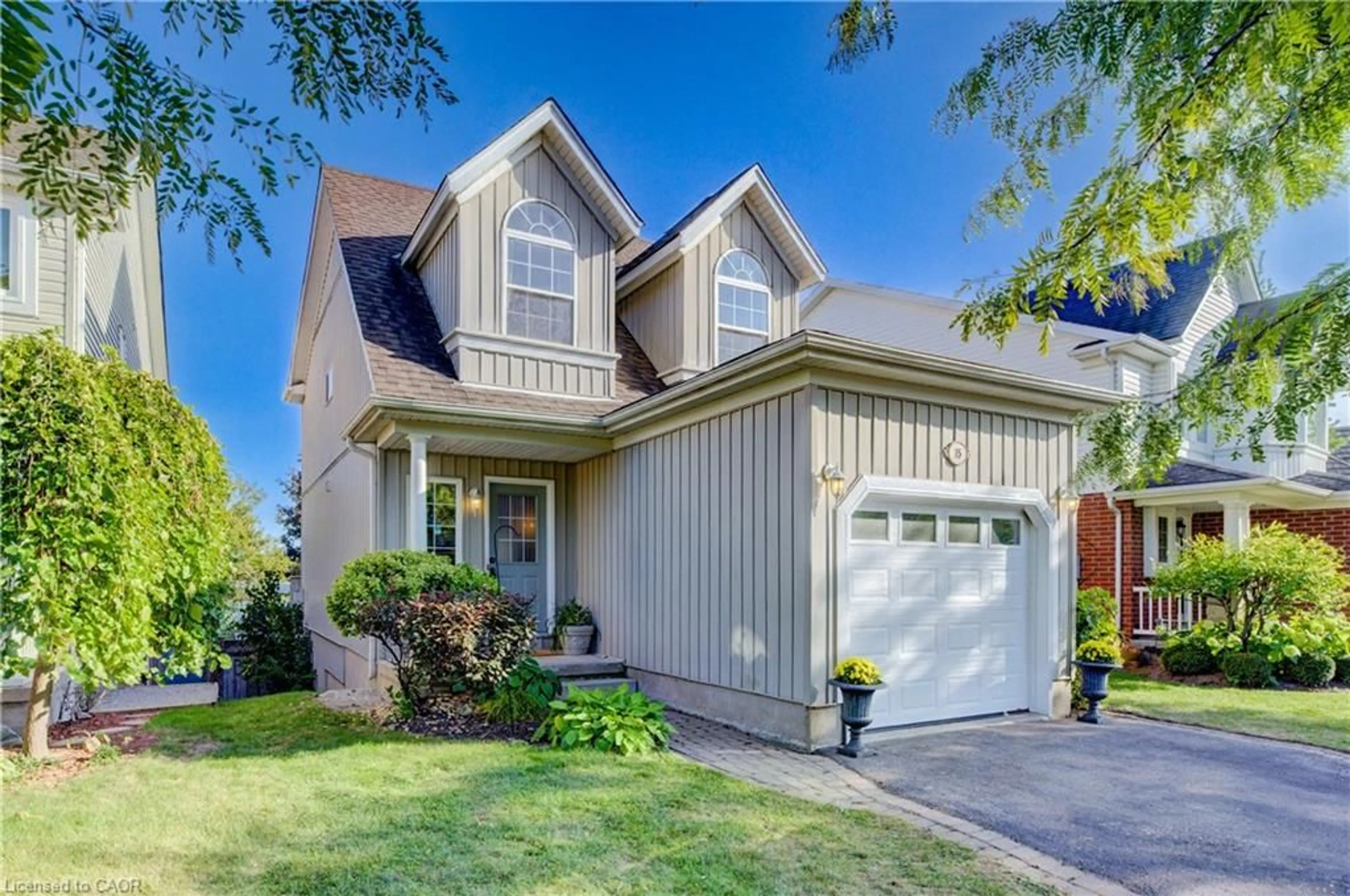 Home with vinyl exterior material, street for 15 Pettitt Dr, Guelph Ontario N1E 7G7