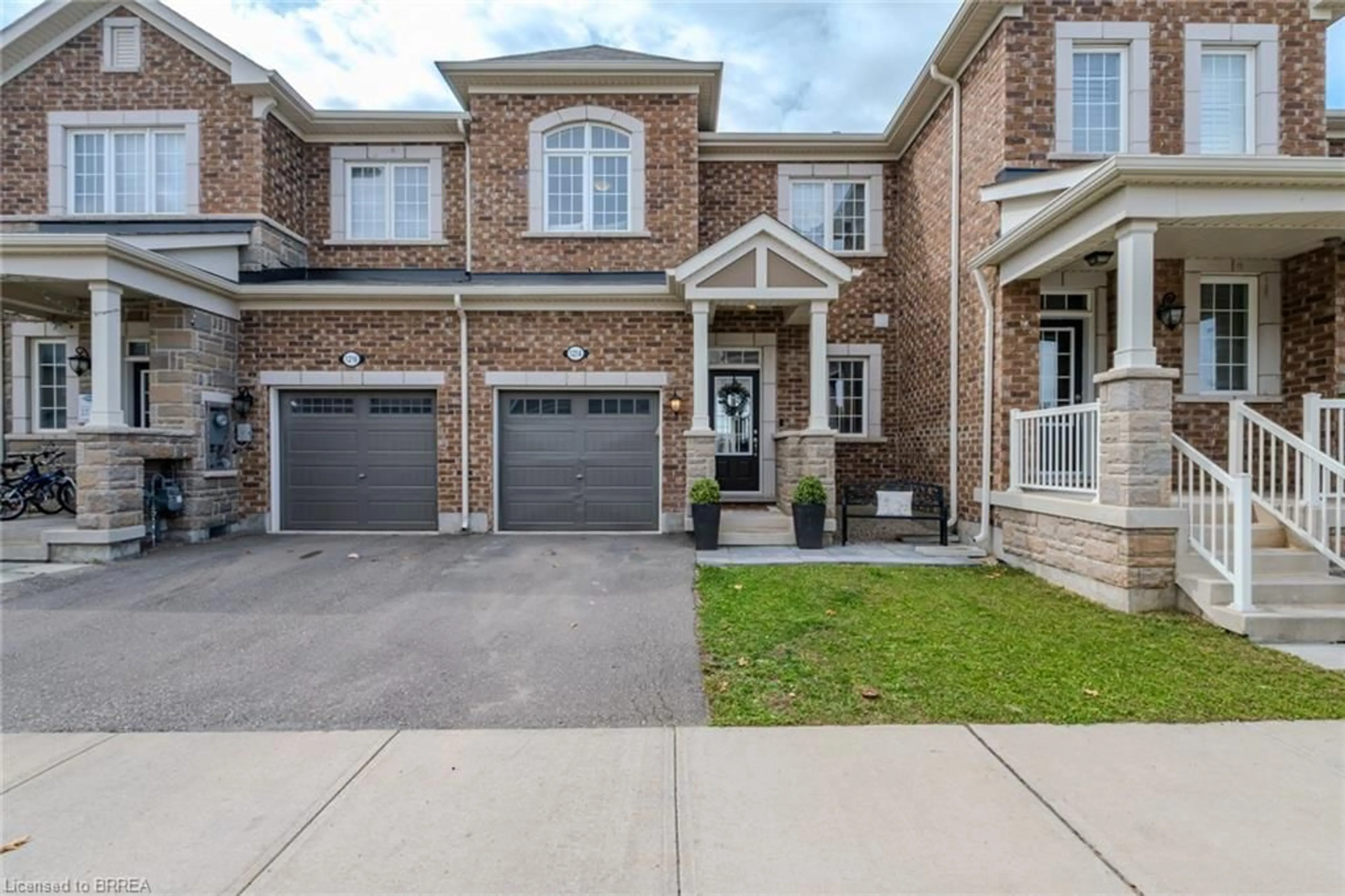 Home with brick exterior material, street for 1214 Rose Way, Milton Ontario L9E 1L9
