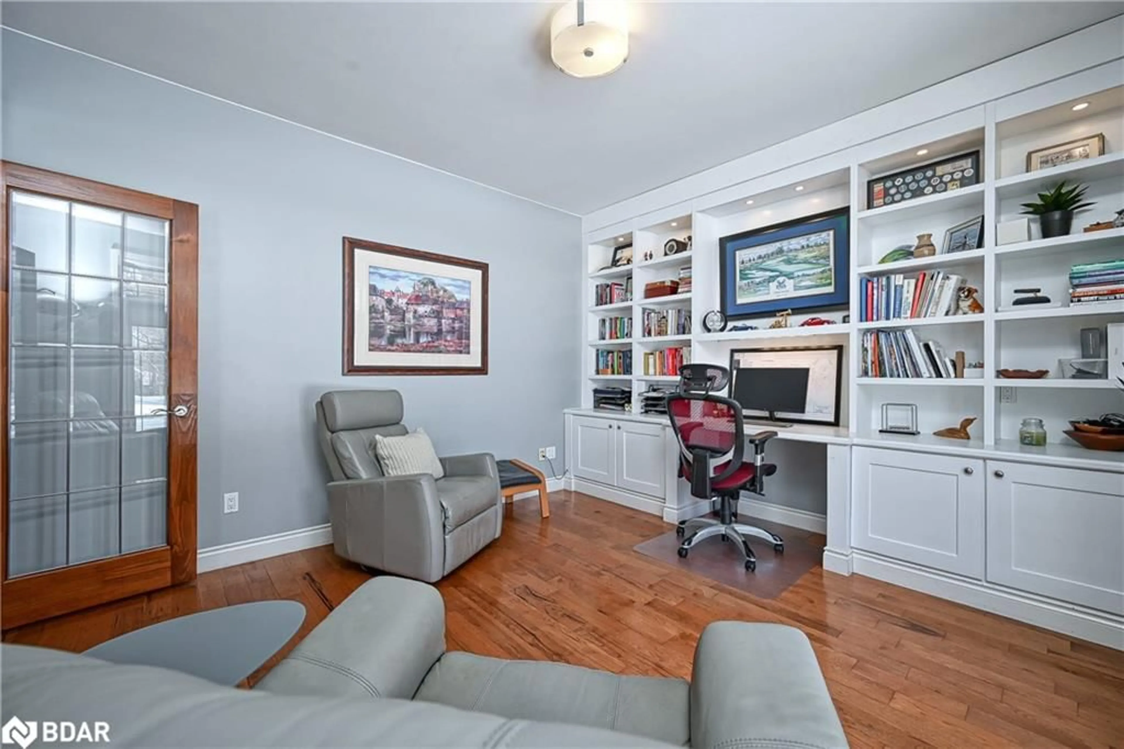 Living room with furniture, wood/laminate floor for 28 Laddie Lane, Minesing Ontario L9X 0C3