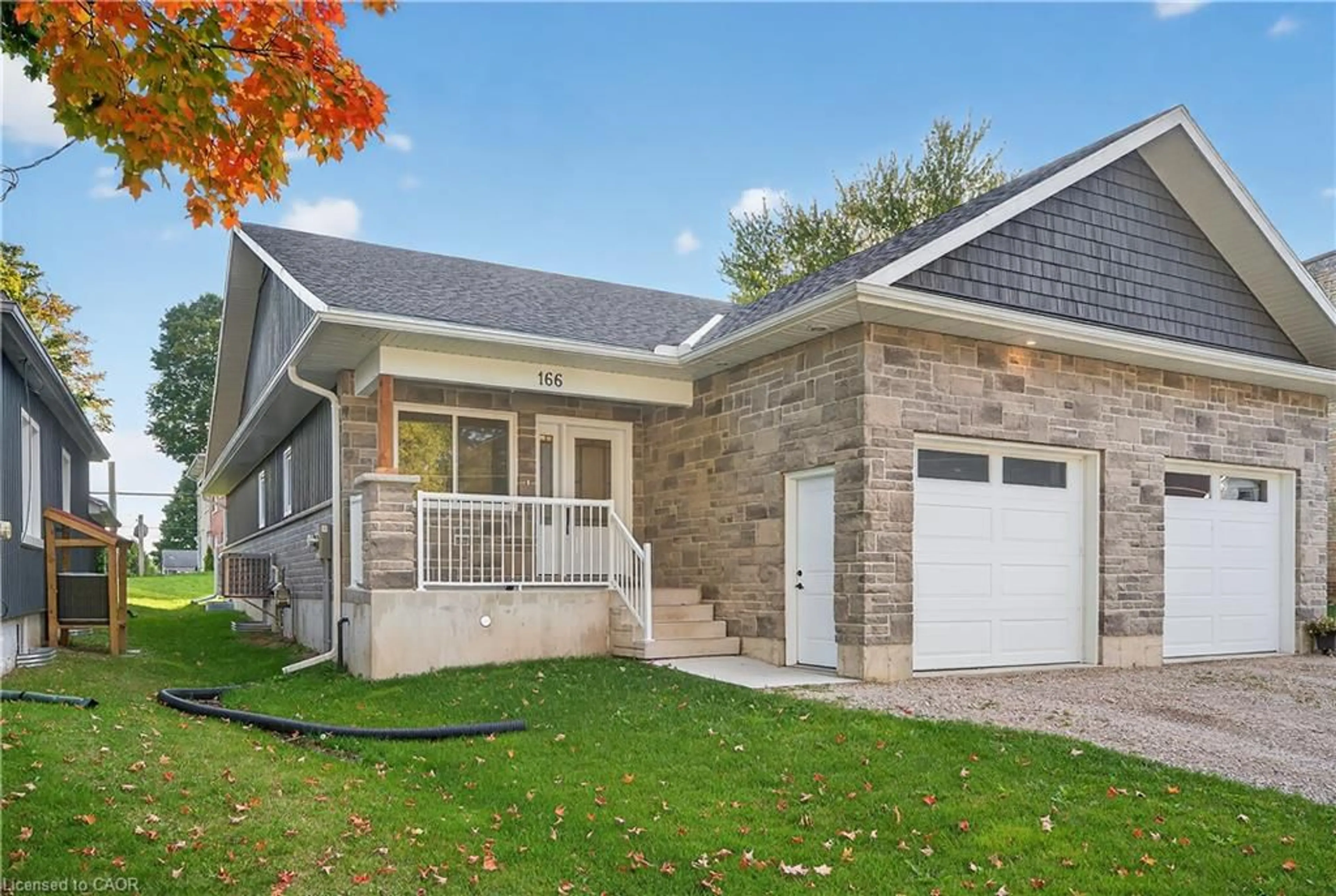 Home with vinyl exterior material, street for 166 Webb St, Harriston Ontario N0G 1Z0