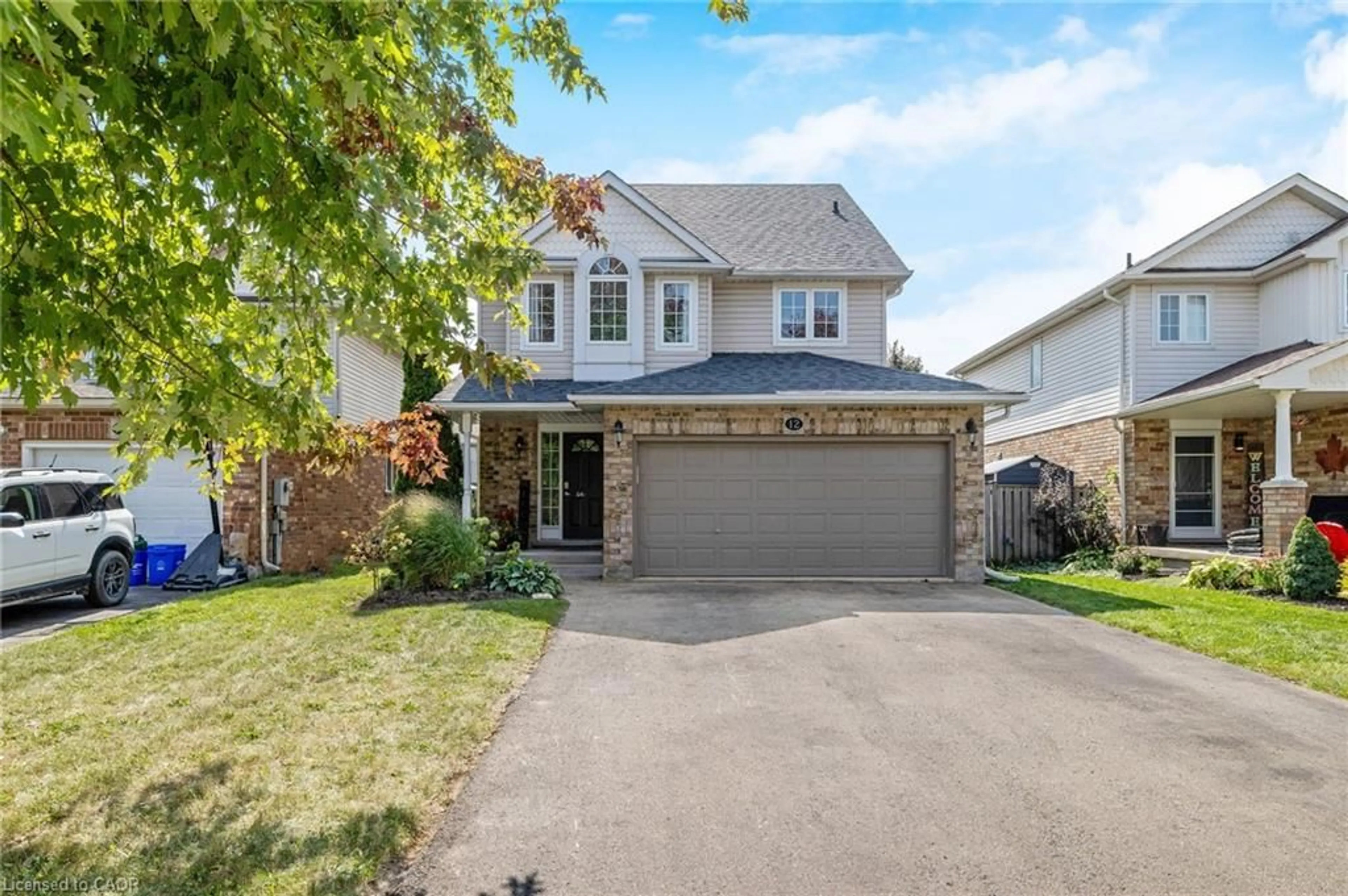 Home with vinyl exterior material, street for 12 Sprowl St, Acton Ontario L7J 3A8