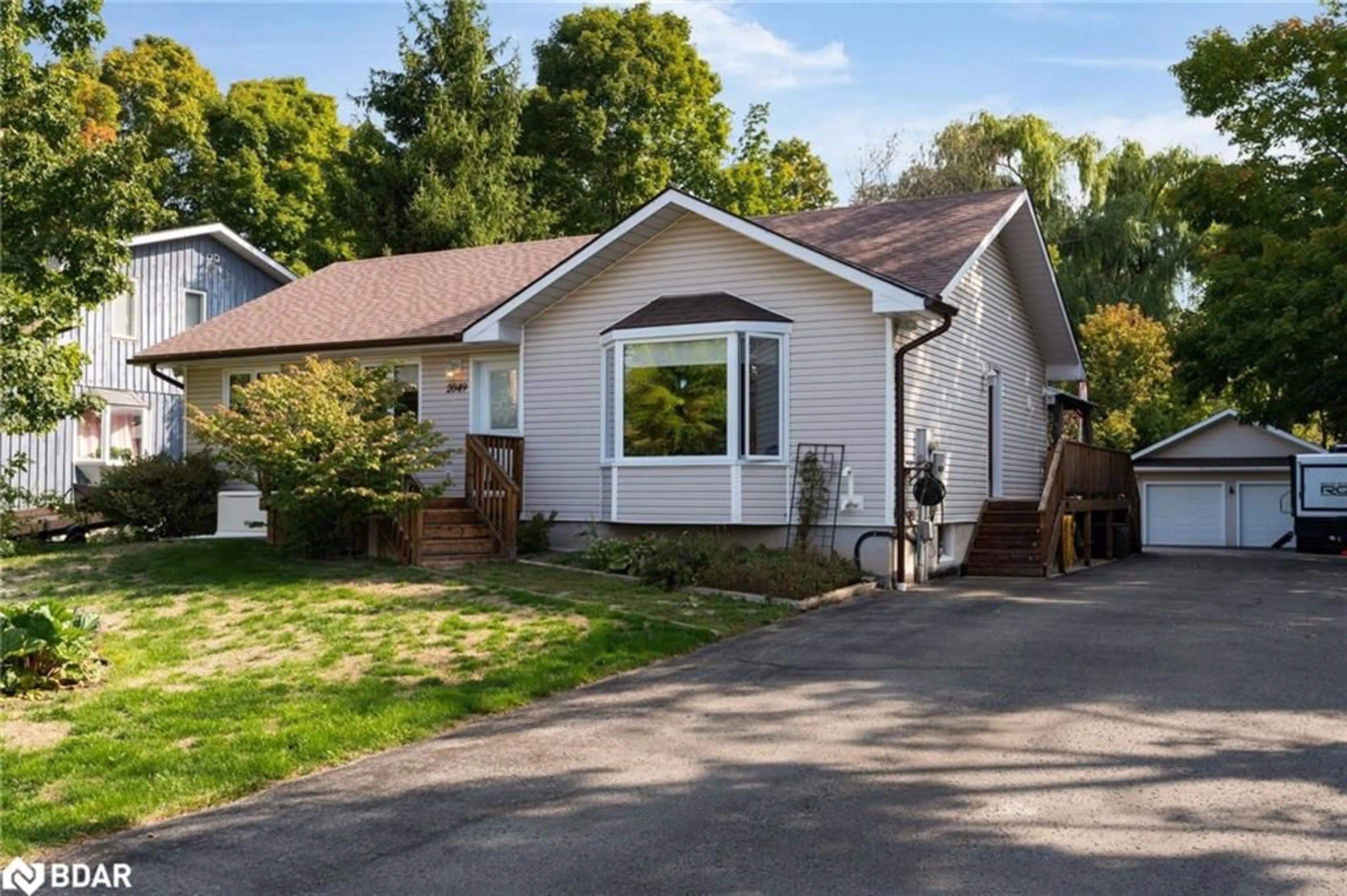 Home with vinyl exterior material, street for 2049 Mountbatten Ave, Innisfil Ontario L9S 1T8