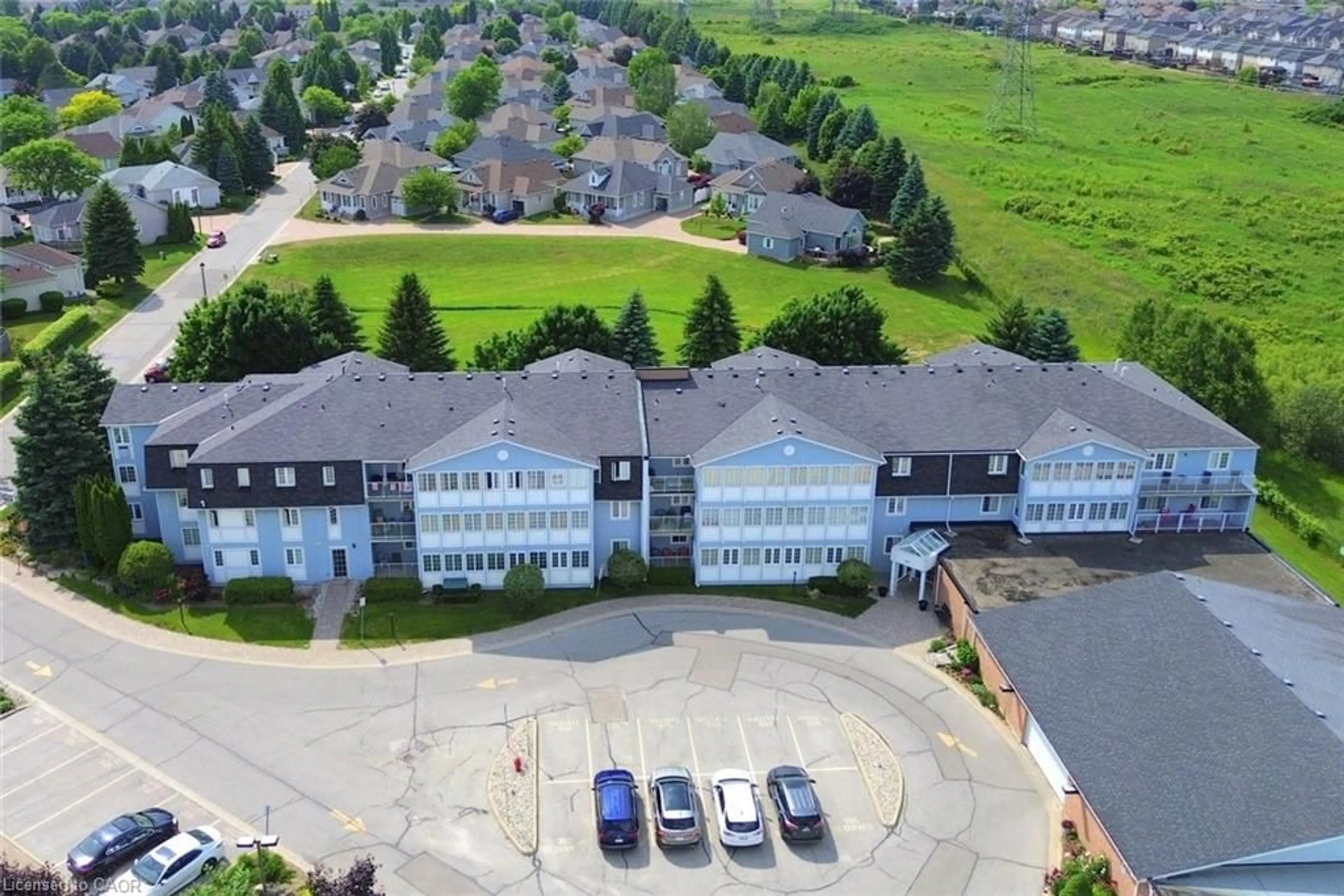A pic from outside/outdoor area/front of a property/back of a property/a pic from drone, unknown for 600 Silverbirch Blvd #205, Mount Hope Ontario L0R 1W0