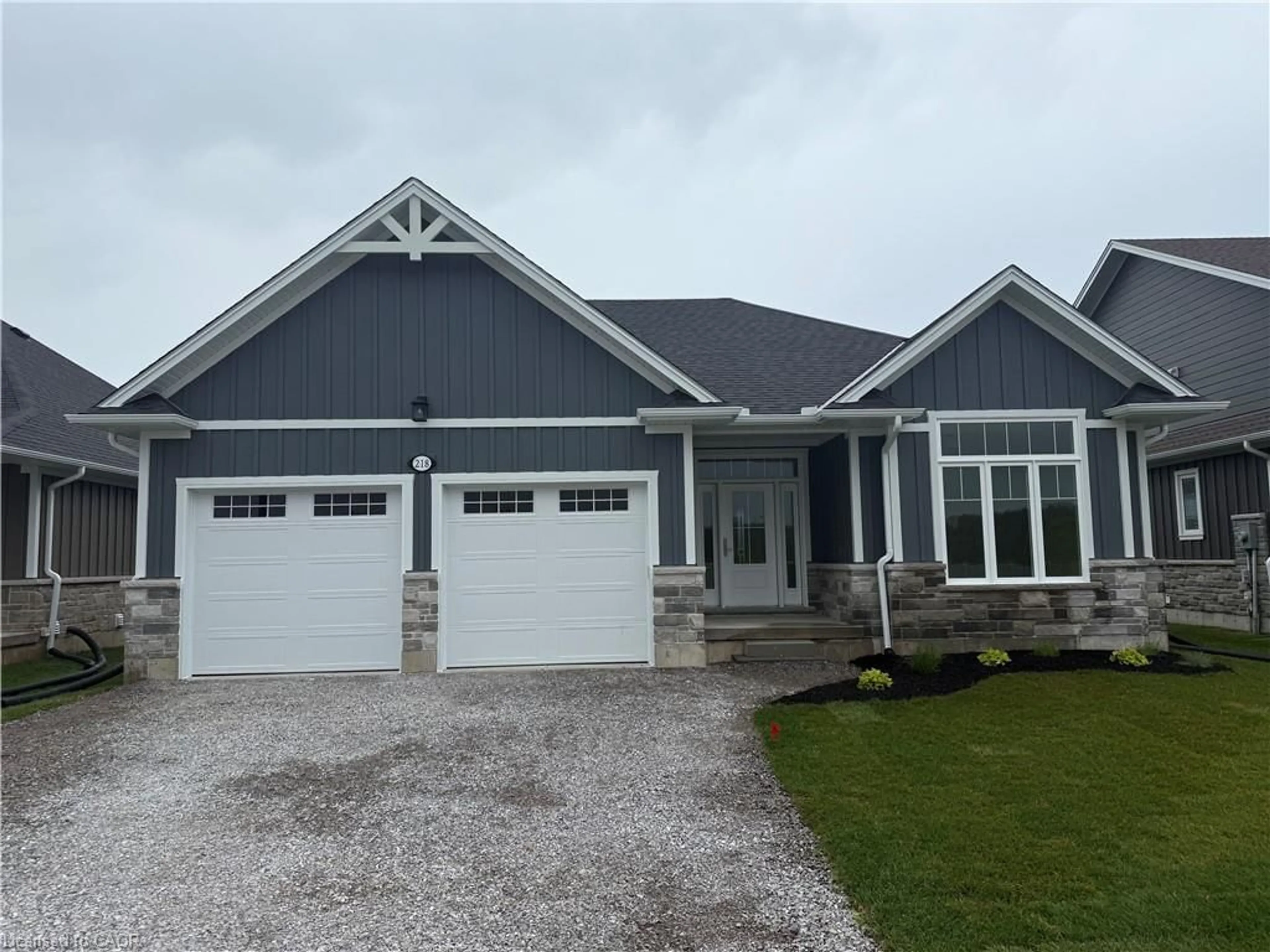 Home with vinyl exterior material, street for 218 Schooner Dr, Port Dover Ontario N0A 1N3