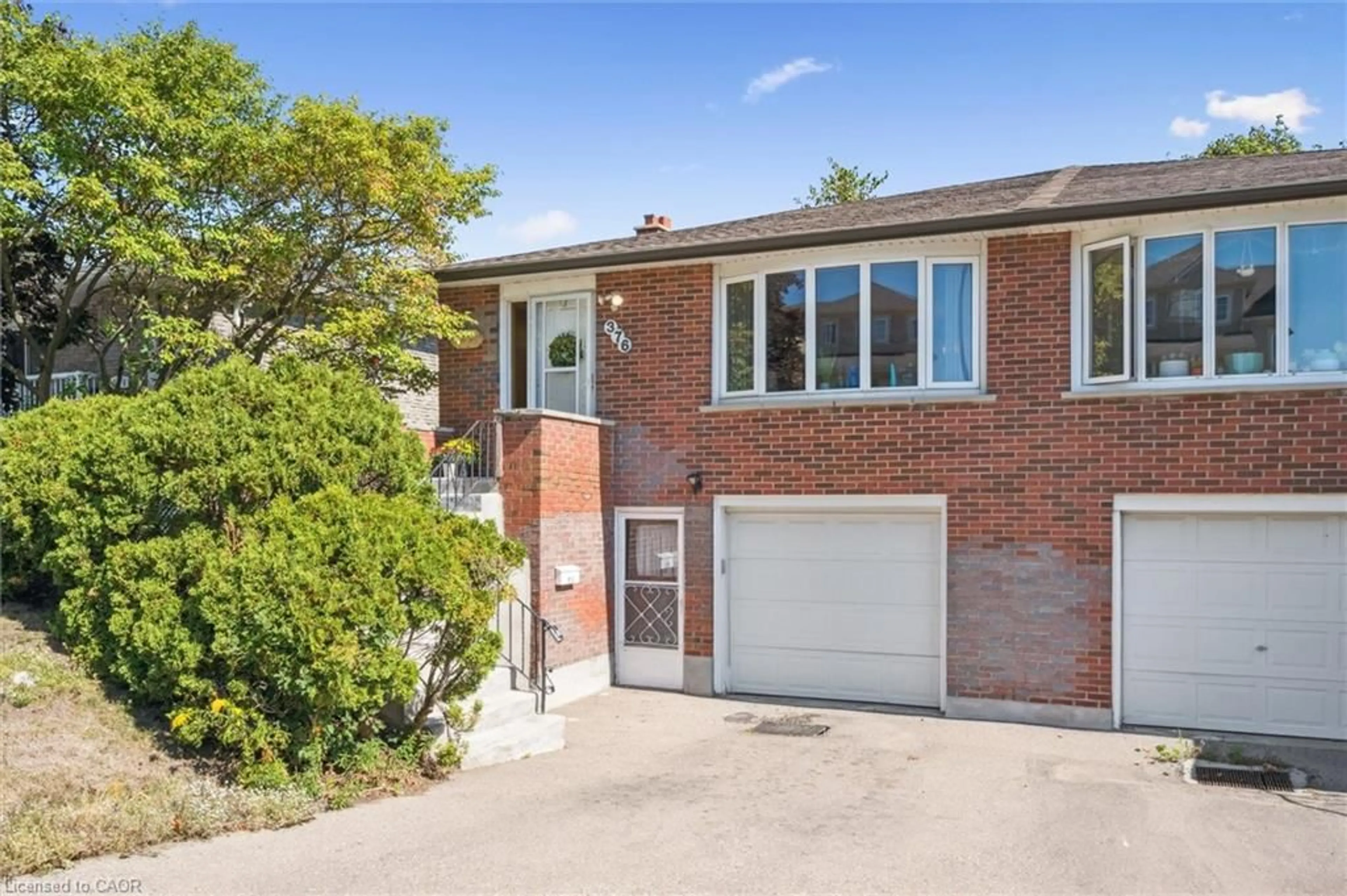 Home with brick exterior material, street for 376 Westwood Dr, Kitchener Ontario N2M 2L6