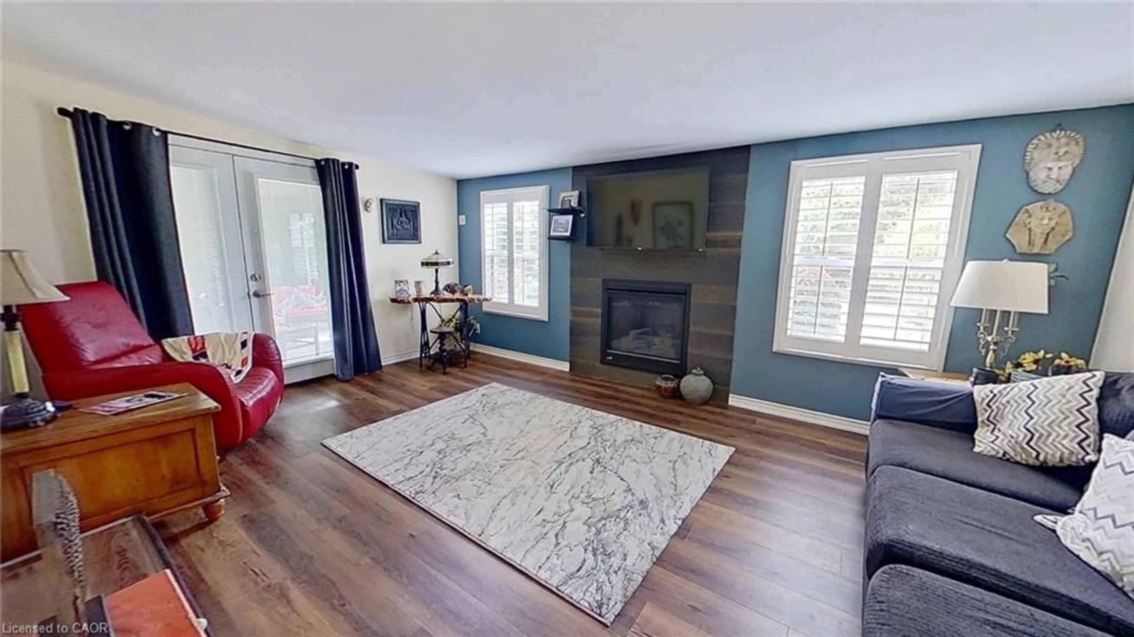 Living room with furniture, wood/laminate floor for 27 Hepburn Ave, St. Thomas Ontario N5R 4J4