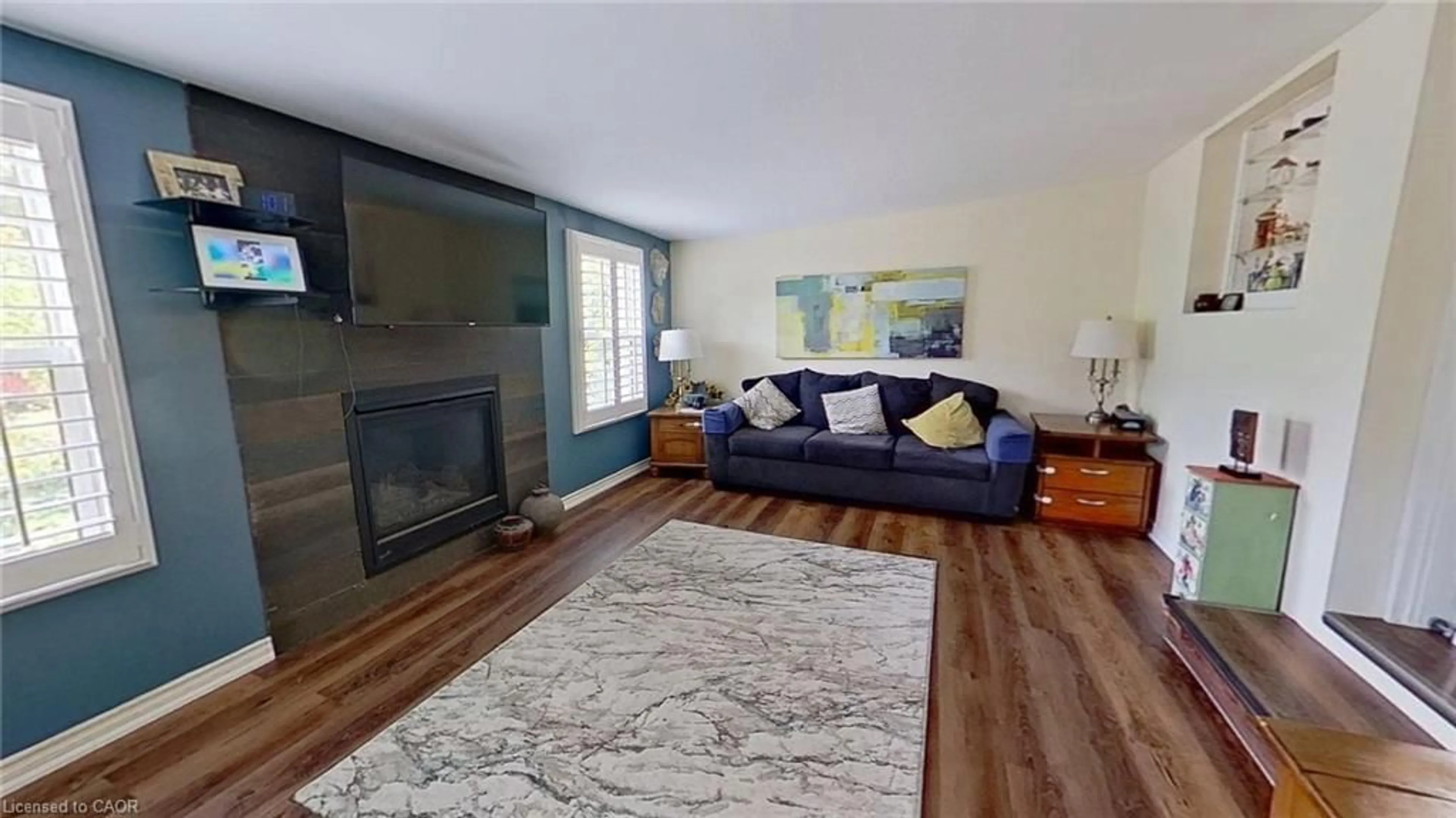 Living room with furniture, wood/laminate floor for 27 Hepburn Ave, St. Thomas Ontario N5R 4J4