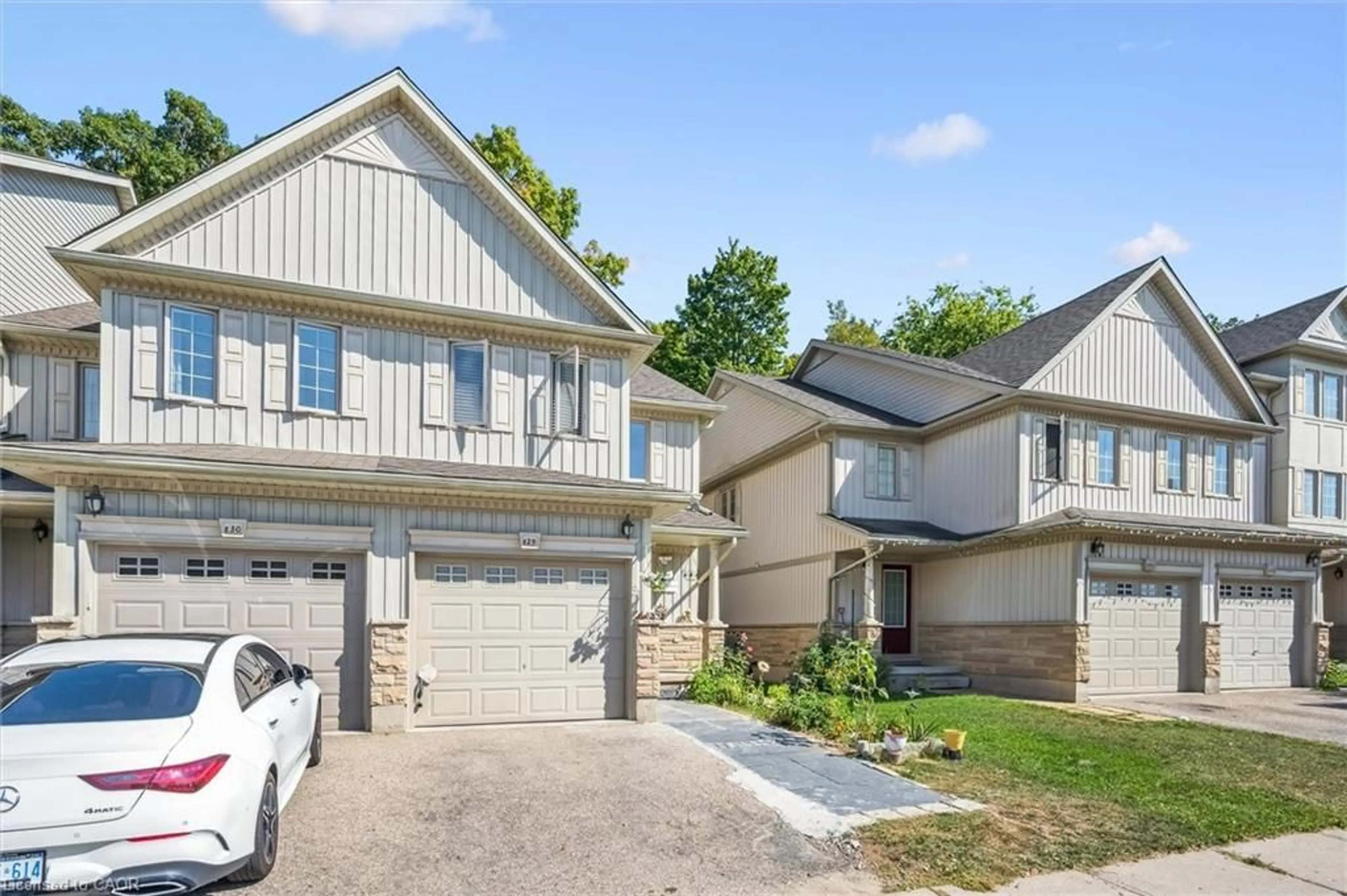 Home with vinyl exterior material, street for 110 Activa Ave #E29, Kitchener Ontario N2E 3T3