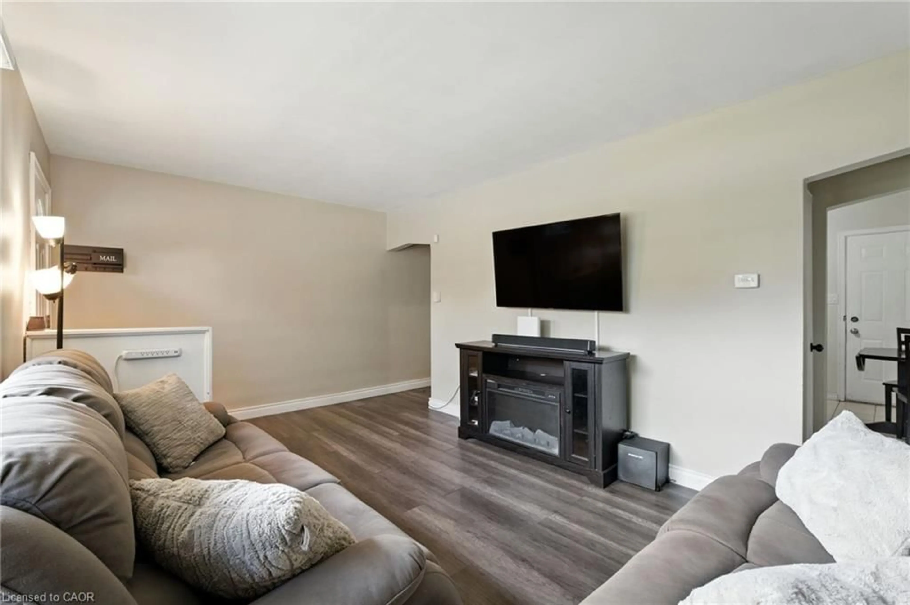 Living room with furniture, wood/laminate floor for 11 Eastvale Pl, Hamilton Ontario L8H 1N9