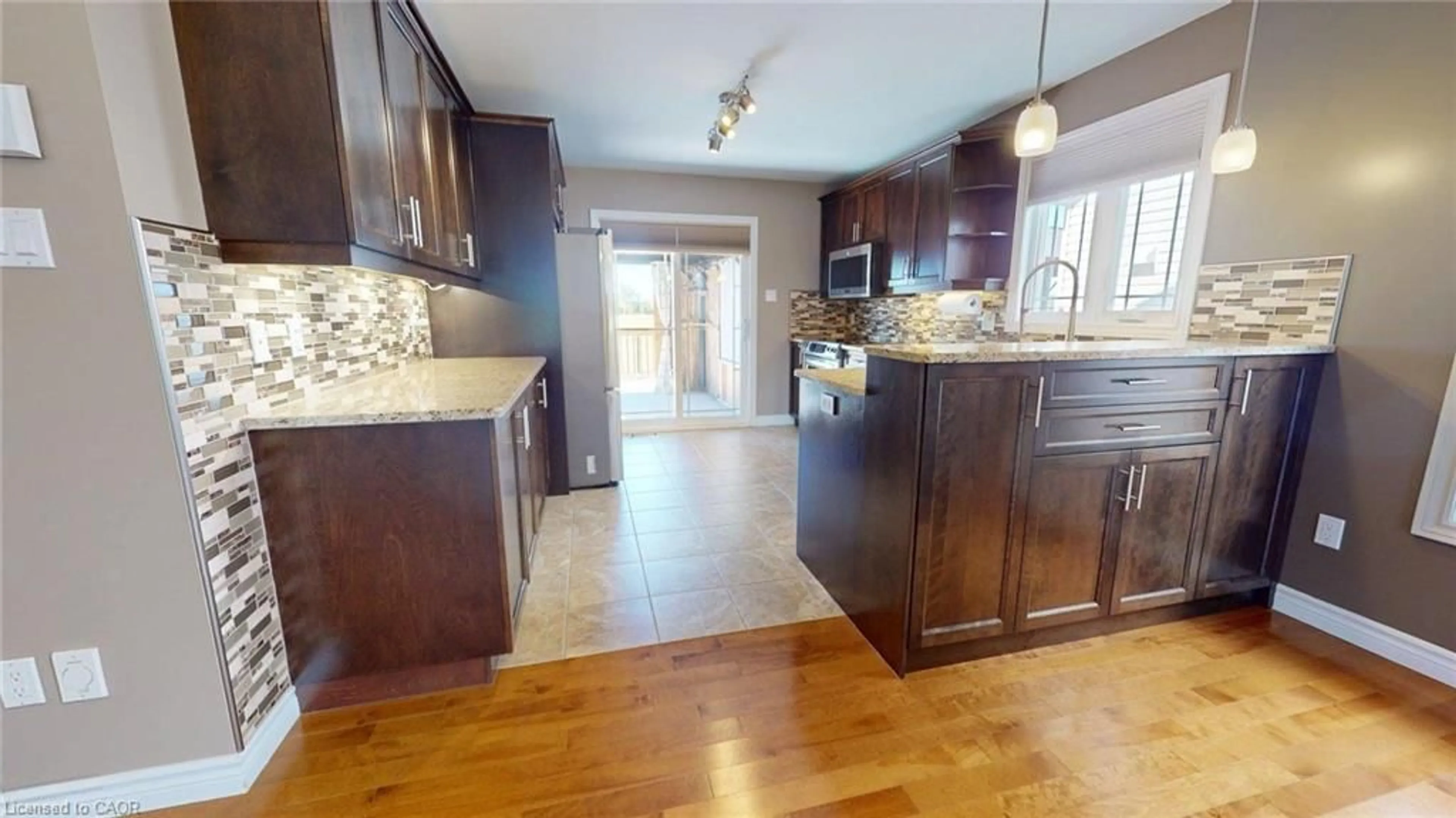 Open concept kitchen, wood/laminate floor for 645 Des Epinettes Pl, Casselman Ontario K0A 1M0