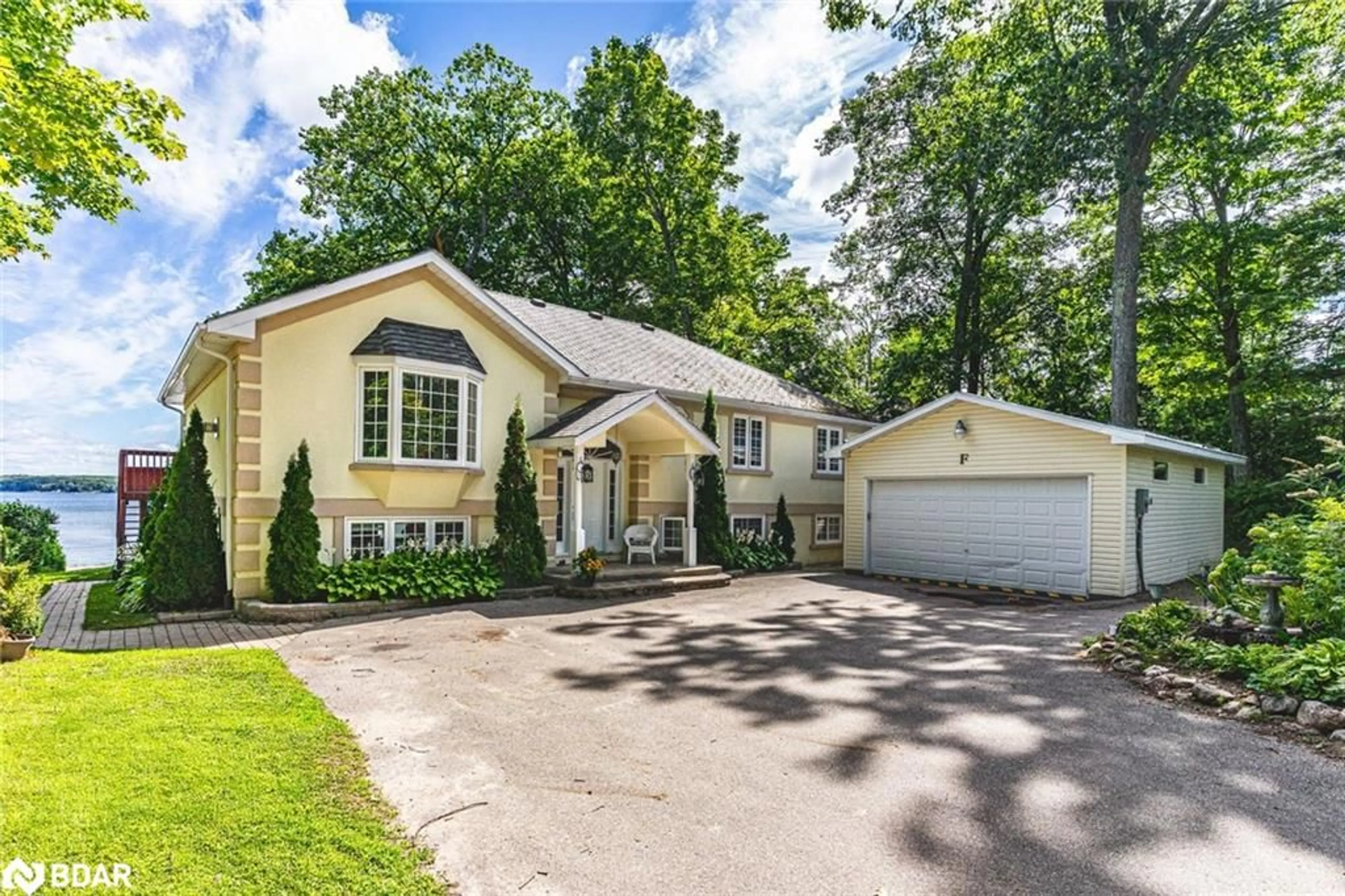Home with vinyl exterior material, street for 383 Peek-A-Boo Trail, Tiny Ontario L9M 0B3