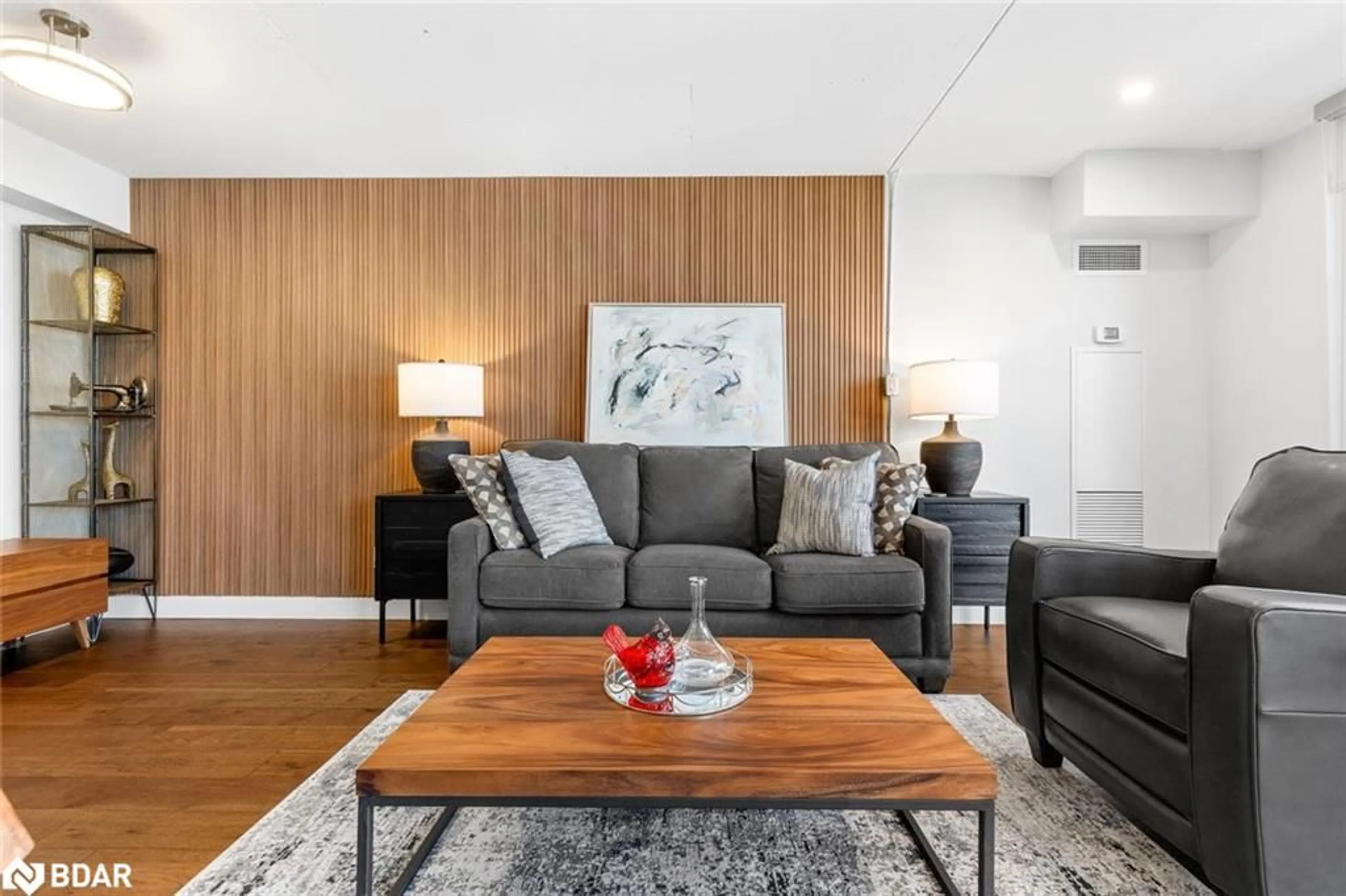 Living room with furniture, wood/laminate floor for 1029 King St #826, Toronto Ontario M6K 3M9