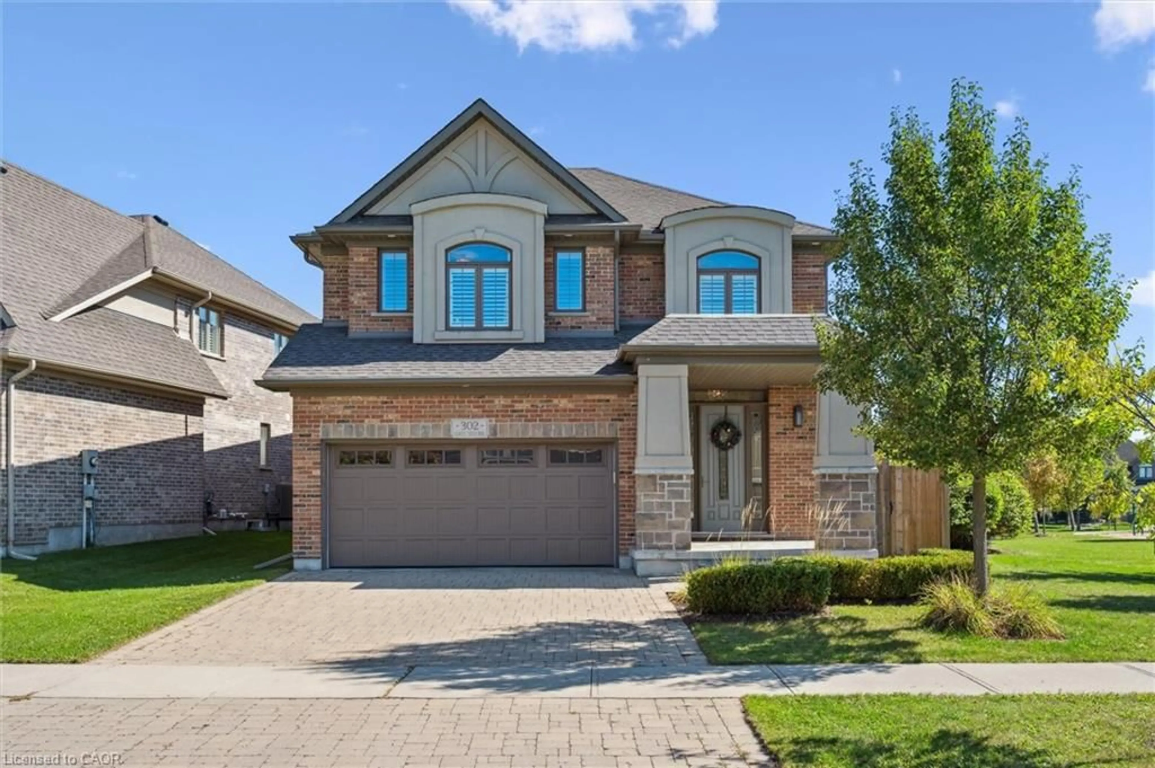 Home with brick exterior material, street for 302 Grey Silo Rd, Waterloo Ontario N2K 0C9