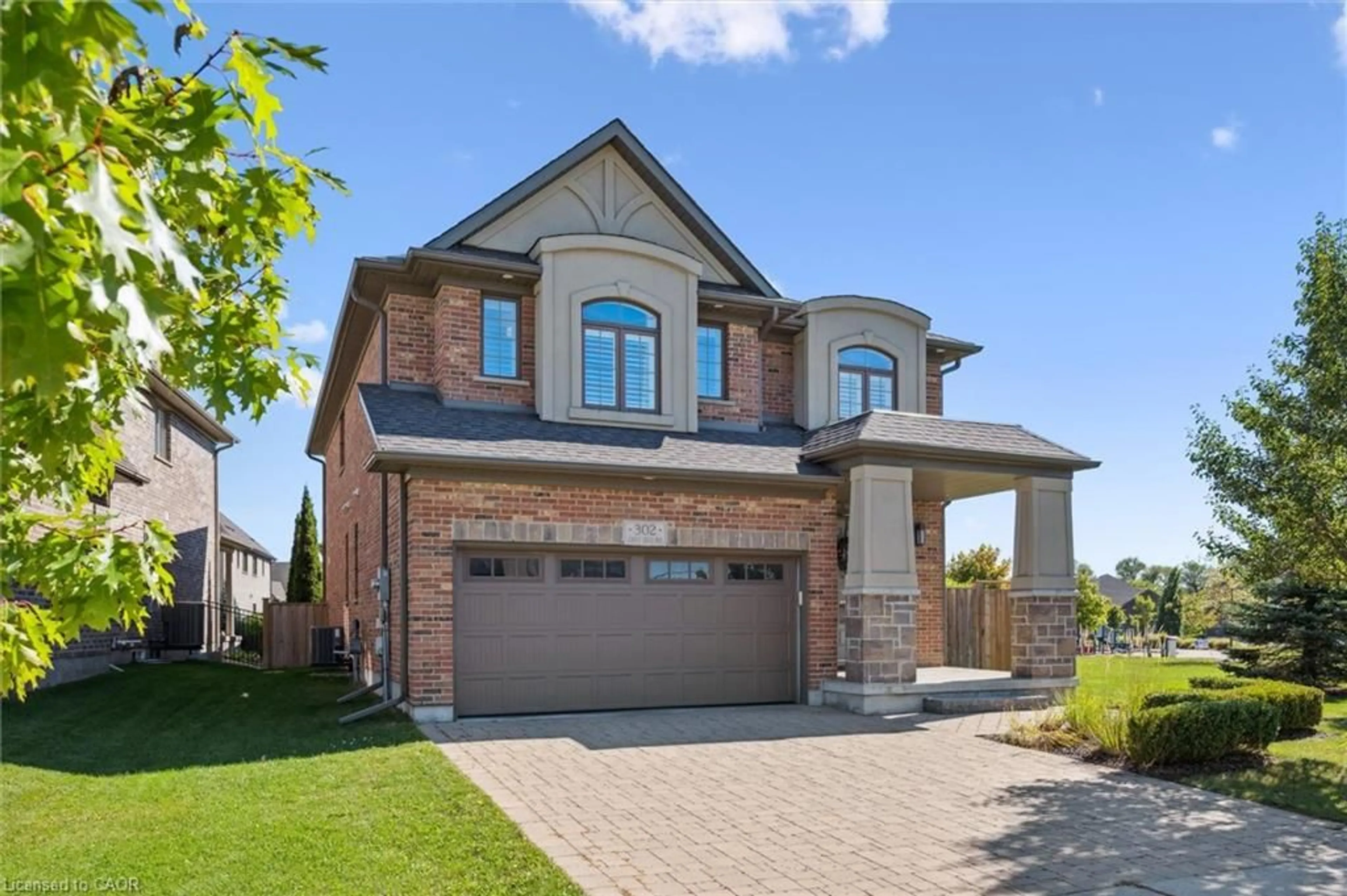 Home with brick exterior material, street for 302 Grey Silo Rd, Waterloo Ontario N2K 0C9