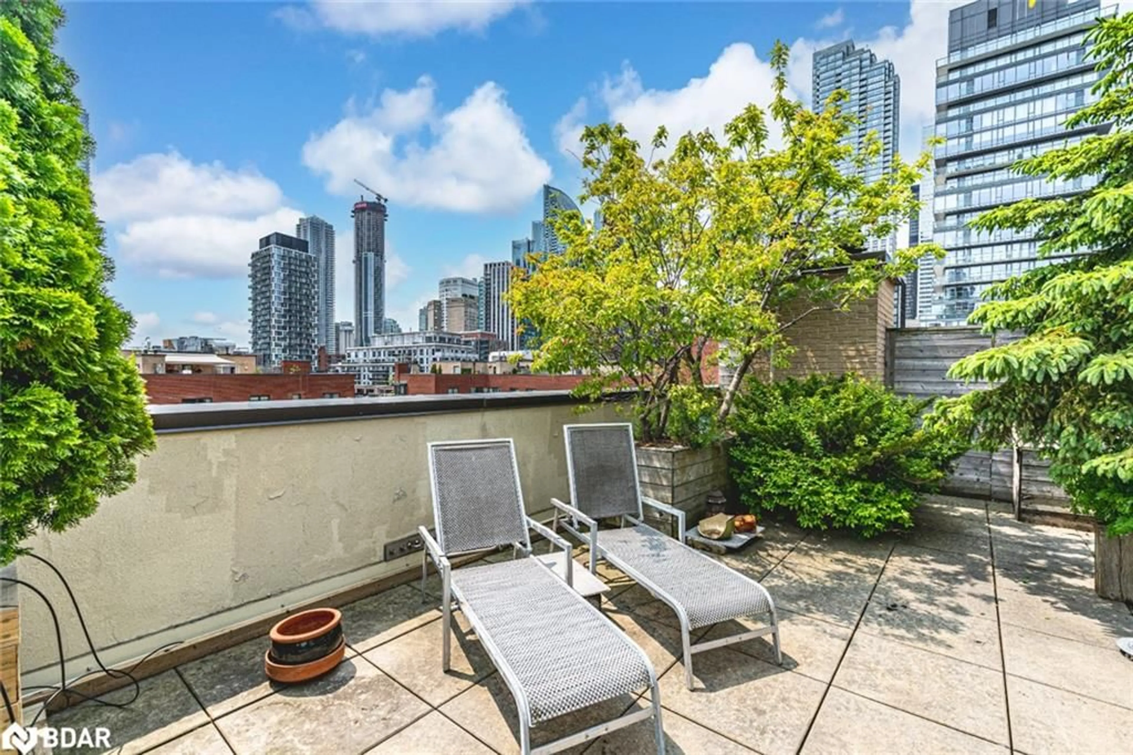Patio, city buildings view from balcony for 80 Front St #824, Toronto Ontario M5E 1T4