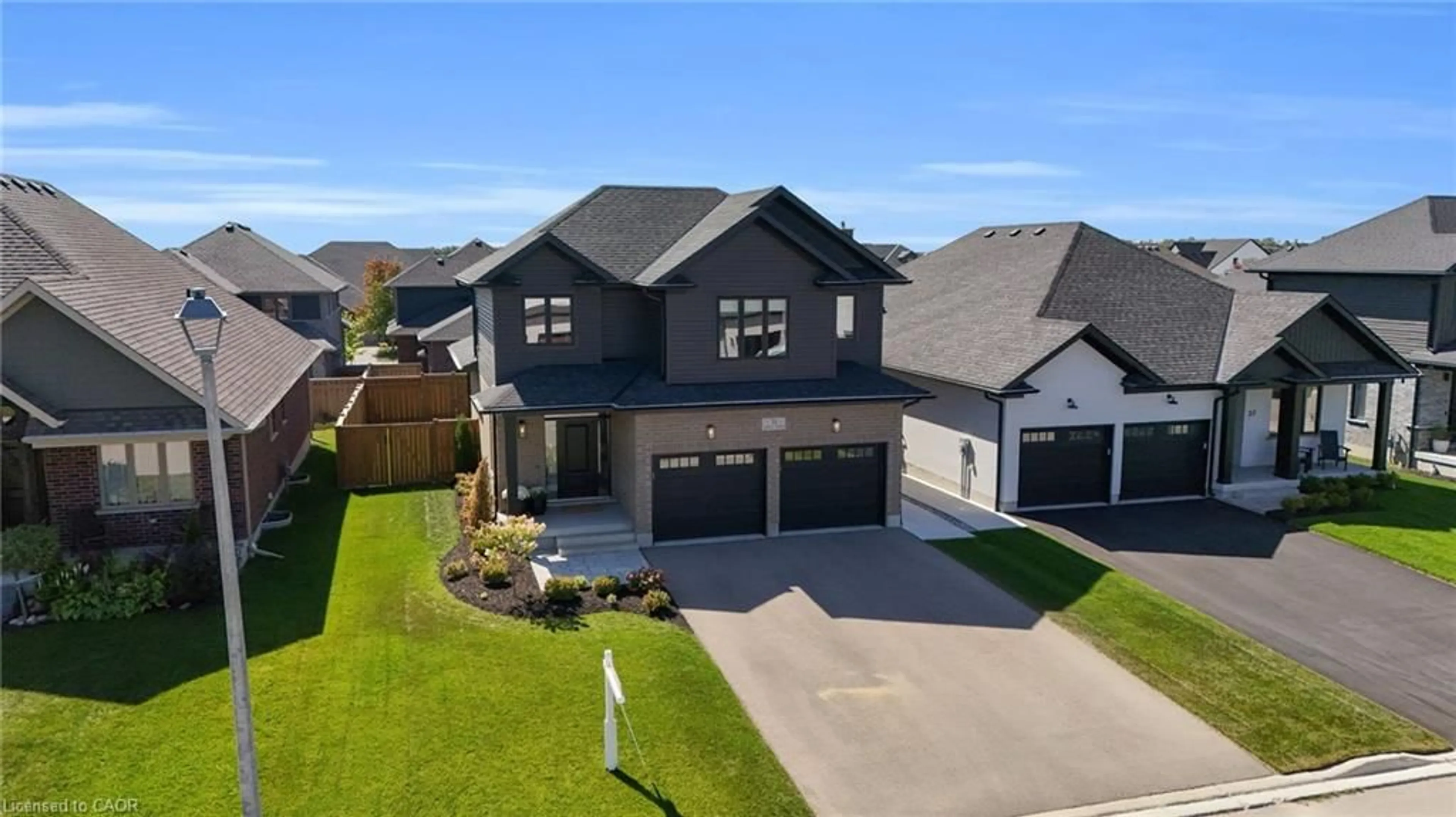 A pic from outside/outdoor area/front of a property/back of a property/a pic from drone, street for 31 Carriage Cross, Drayton Ontario N0G 1P0