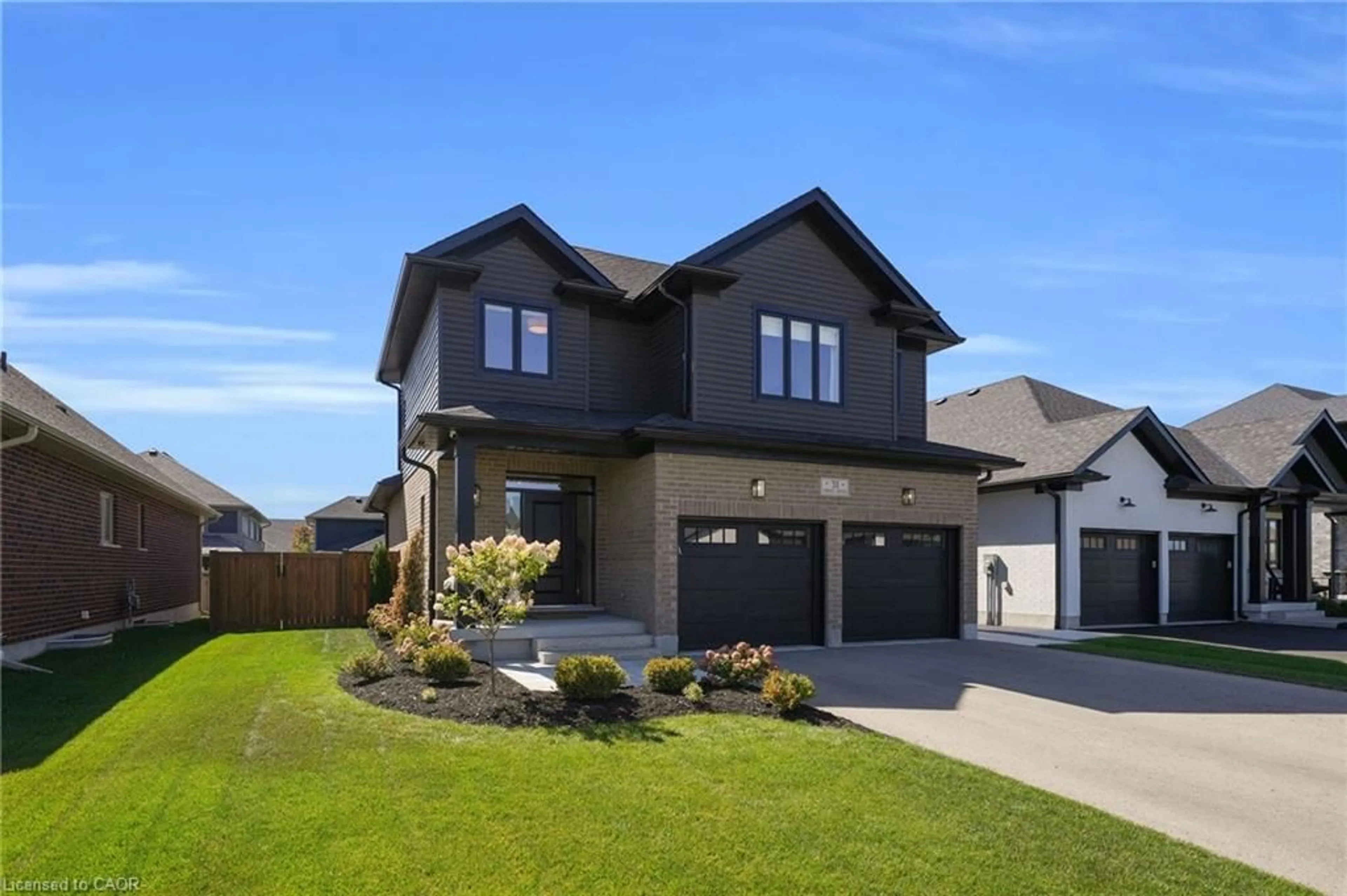 Home with brick exterior material, street for 31 Carriage Cross, Drayton Ontario N0G 1P0