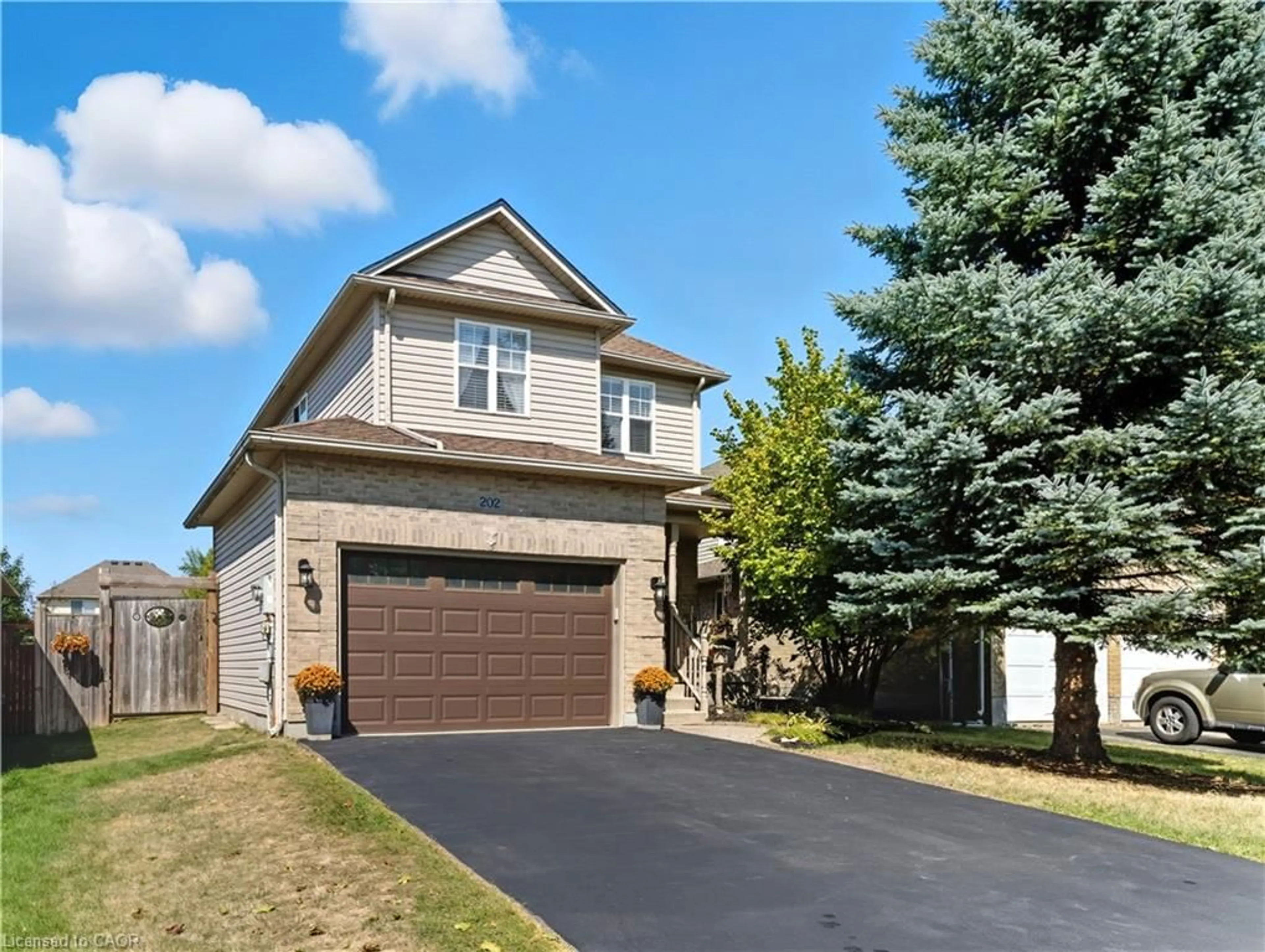 Home with brick exterior material, street for 202 Hilltop Dr, Ayr Ontario N0B 1E0