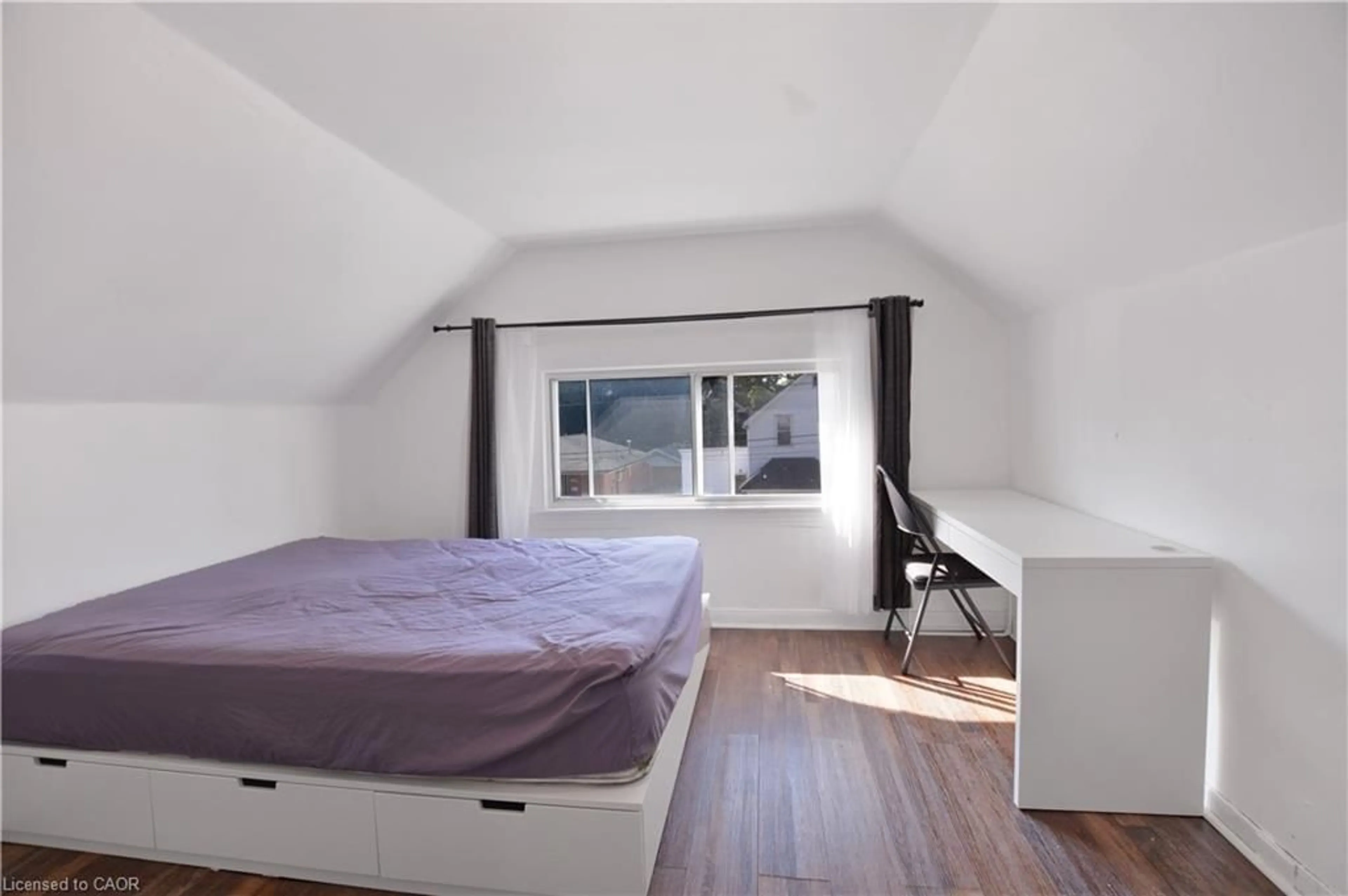 Bedroom with bed, wood/laminate floor for 61 Broadway Ave, Hamilton Ontario L8S 2V9