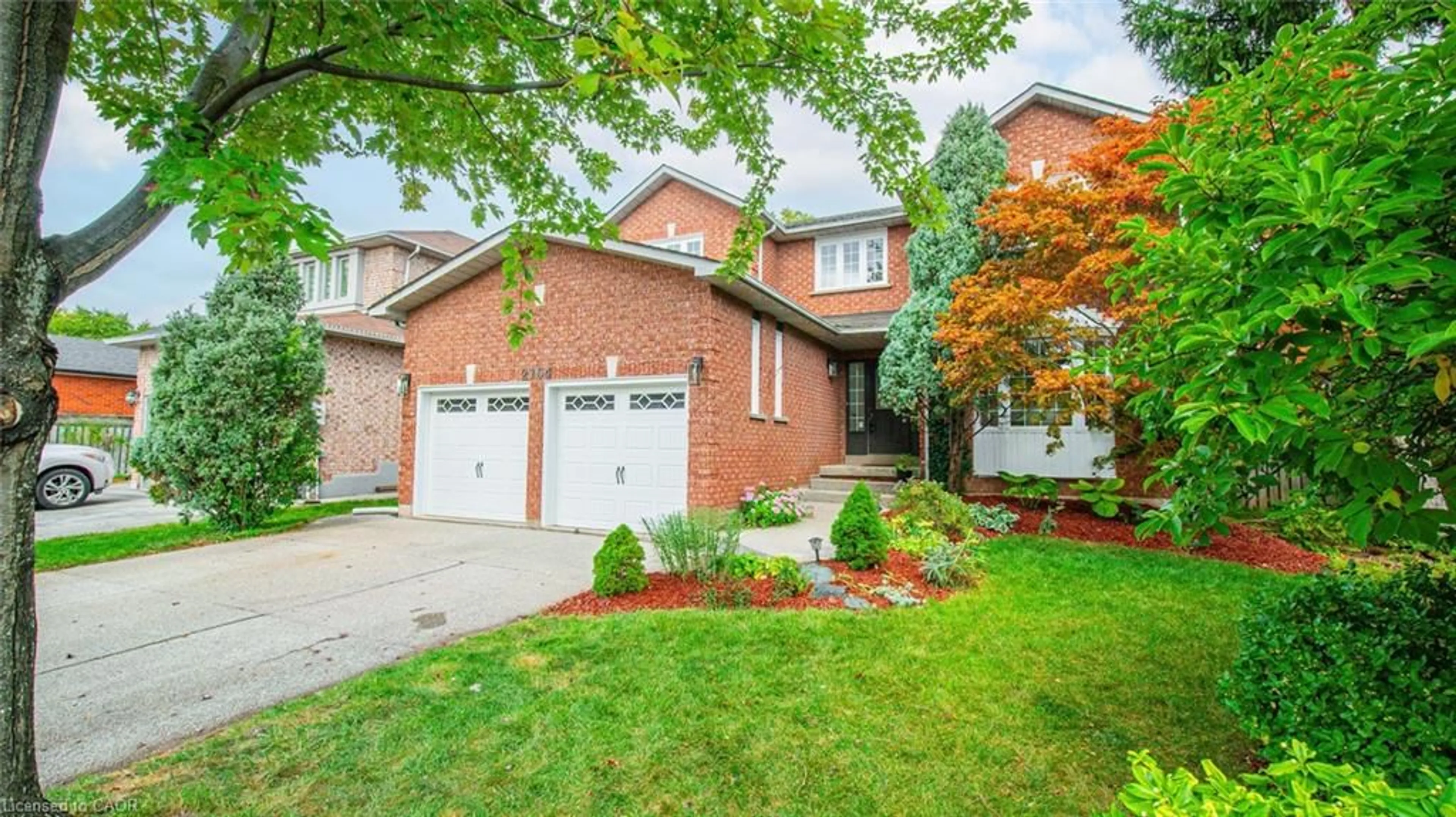 Home with brick exterior material, street for 2164 Winding Woods Dr, Oakville Ontario L6H 5T8